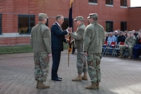 men in group pass flag