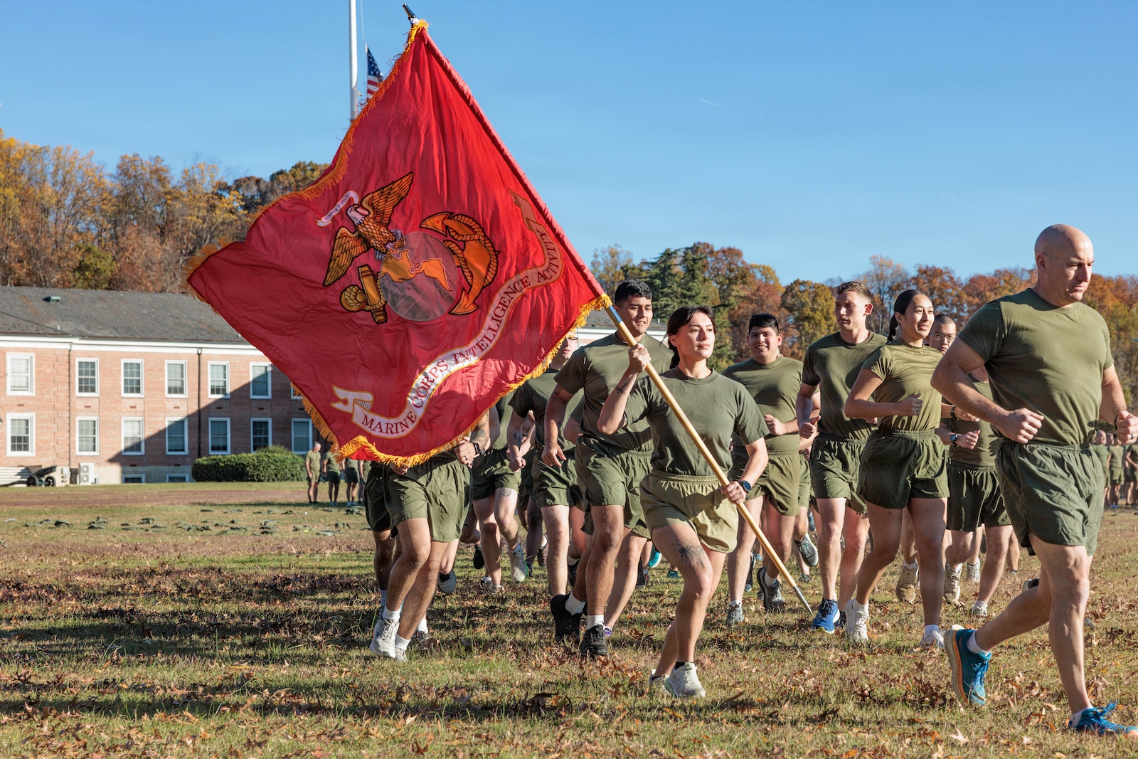 U.S. Marines run in formation to celebrate the 250th Marine Corps Birthday on MCB Quantico, Nov. 6, 2025. Marines from across the installation participated in a motivational run emphasizing esprit de corps and physical readiness showcasing unity and pride in their shared heritage. (U.S. Marine Corps photo by Lance Cpl. Jeffery Stevens)