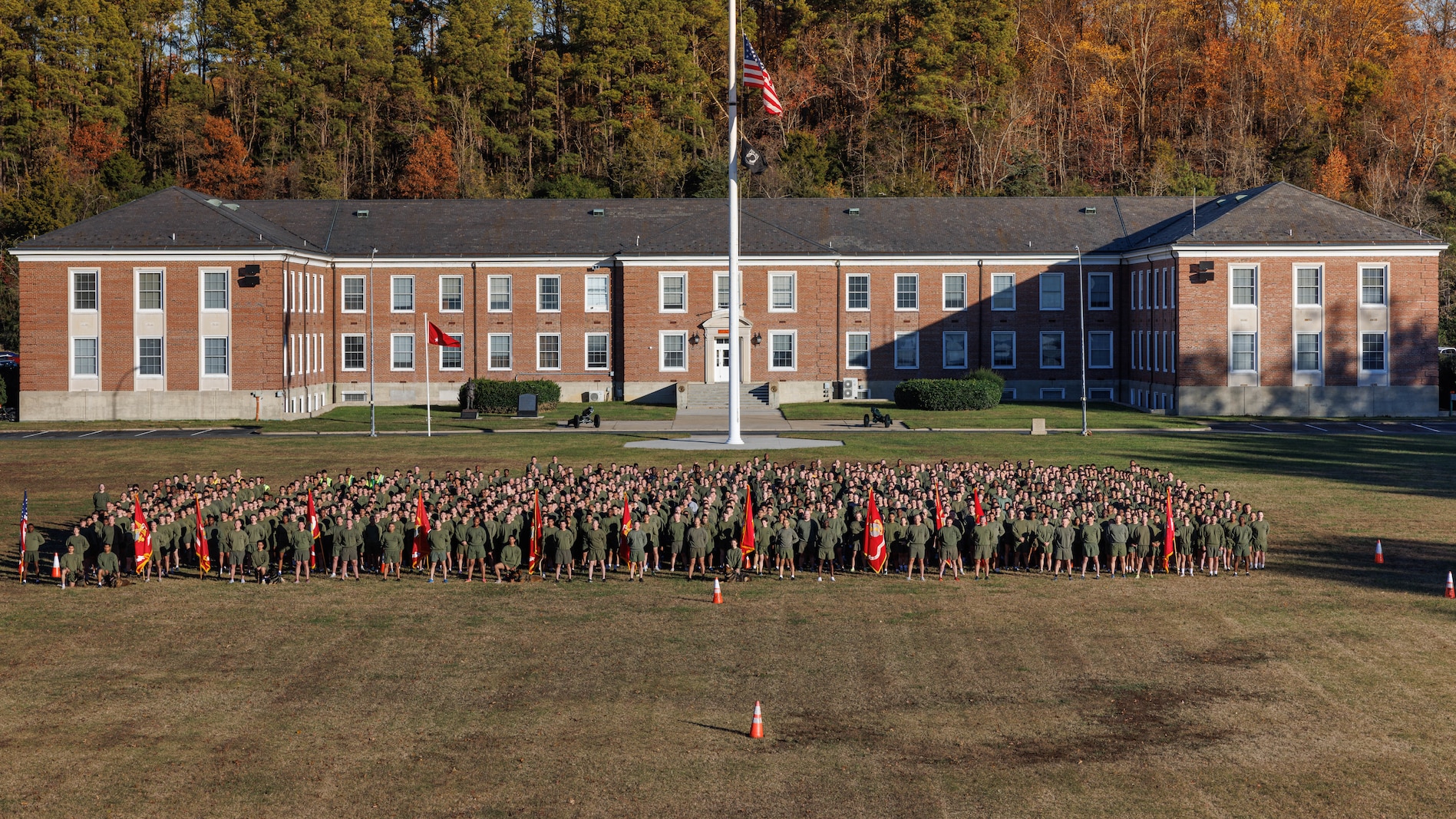 U.S. Marines stationed on Marine Corps Base Quantico pose for a photo celebrating the Marine Corps’ 250th birthday before a motivational run on MCB Quantico, Virginia, Nov. 6, 2025. Marines from across the installation participated in a motivational run emphasizing esprit de corps and physical readiness showcasing unity and pride in their shared heritage. (U.S. Marine Corps photo by Lance Cpl. Harleigh Faulk)