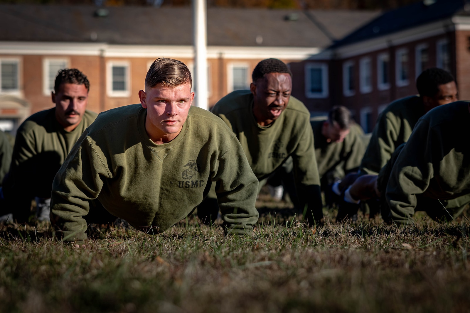 U.S. Marines stationed on Marine Corps Base Quantico conduct push-ups celebrating the Marine Corps’ 250th birthday before a motivational run on MCB Quantico, Virginia, Nov. 6, 2025. Marines from across the installation participated in a motivational run emphasizing esprit de corps and physical readiness showcasing unity and pride in their shared heritage. (U.S. Marine Corps photo by Lance Cpl. Harleigh Faulk)