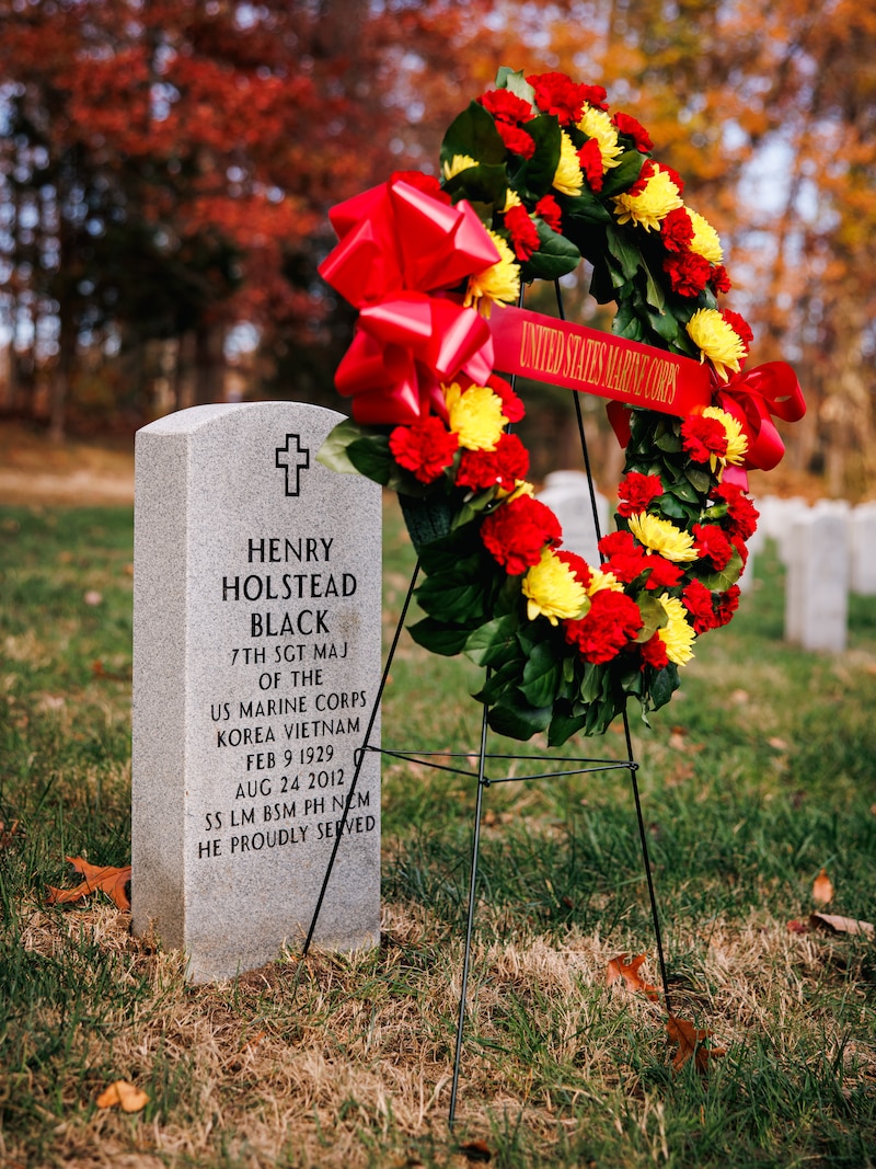 A wreath is staged at the gravesite of Sgt. Maj. Henry Black, the seventh Sergeant Major of the Marine Corps at the Quantico National Cemetery, Triangle, Virginia, November 10, 2025. This wreath laying ceremony honored Sgt. Maj. Henry Black, the seventh Sergeant Major of the Marine Corps, who served in active duty from 1948 to 1977, fighting in the Korean War, Vietnam War, and training recruits as a drill instructor at Marine Corps Recruit Depot Parris Island. (U.S. Marine Corps photo by Cpl. Braydon Rogers)