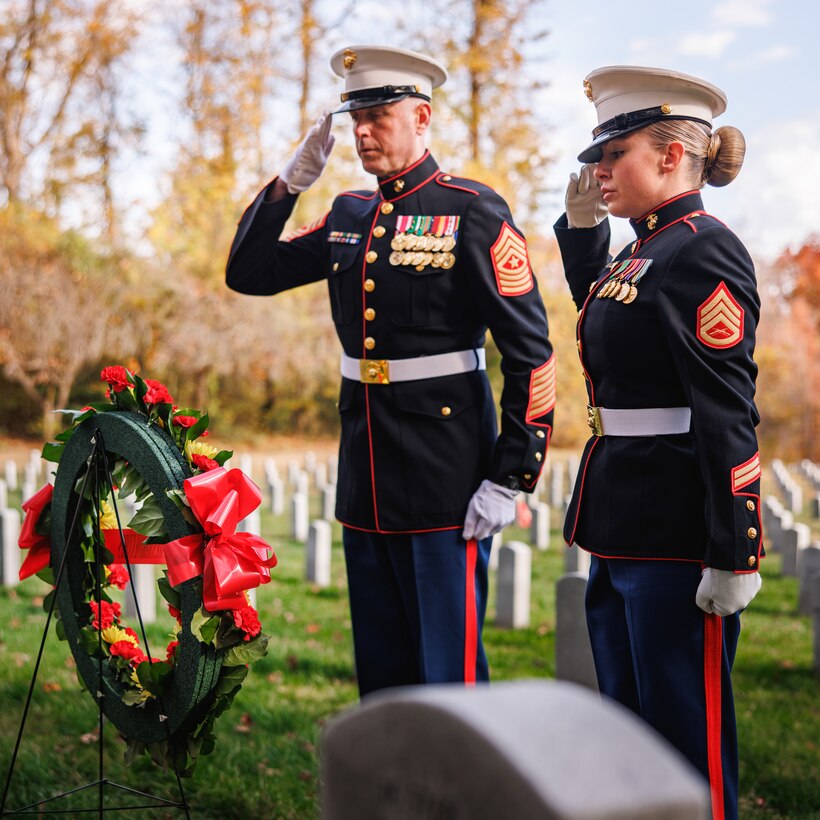 U.S. Marine Corps Sgt. Maj. Liam Williams, sergeant major of Marine Corps Base Quantico, left, and Staff Sgt. Courtney Montecalvo, the staff non-commissioned officer in charge with the MCB Quantico Ceremonial Platoon, salute during the wreath laying ceremony of Sgt. Maj. Henry Black at the Quantico National Cemetery, Triangle, Virginia, November 10, 2025. This wreath laying ceremony honored Sgt. Maj. Henry Black, the seventh Sergeant Major of the Marine Corps, who served in active duty from 1948 to 1977, fighting in the Korean War, Vietnam War, and training recruits as a drill instructor at Marine Corps Recruit Depot Parris Island. (U.S. Marine Corps photo by Cpl. Braydon Rogers)