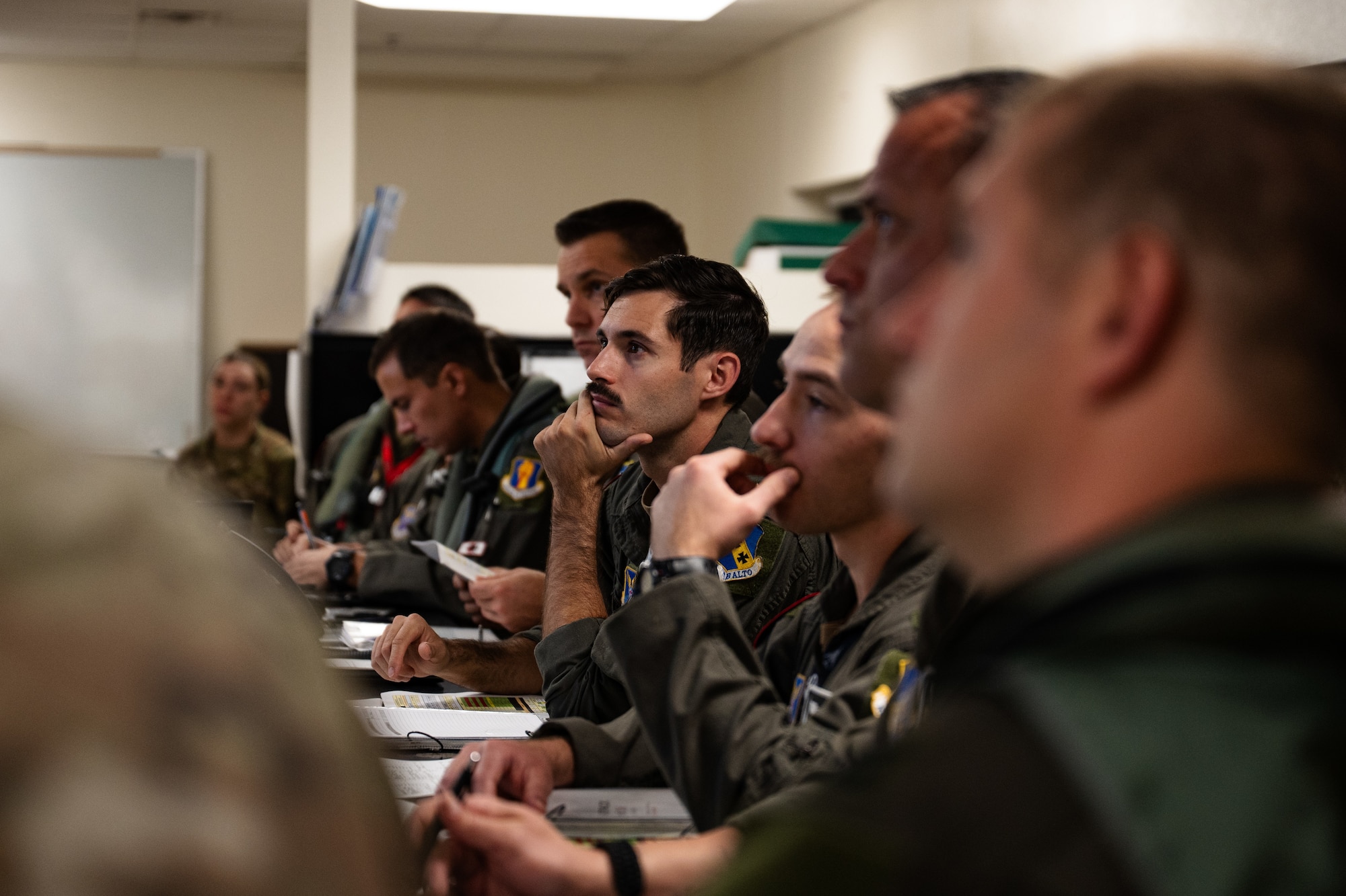 U.S. Airmen assigned to the 9th Bomb Squadron receive a preflight mission brief in support of a Bomber Task Force deployment at Dyess Air Force Base, Texas, Oct. 16, 2025. Regular bomber missions in the Indo-Pacific ensure 7th Bomb Wing crews are highly trained, fully prepared, and capable of operating anytime, anywhere to defend U.S. interests and support our allies. (U.S. Air Force photo by Senior Airman Jade M. Caldwell)