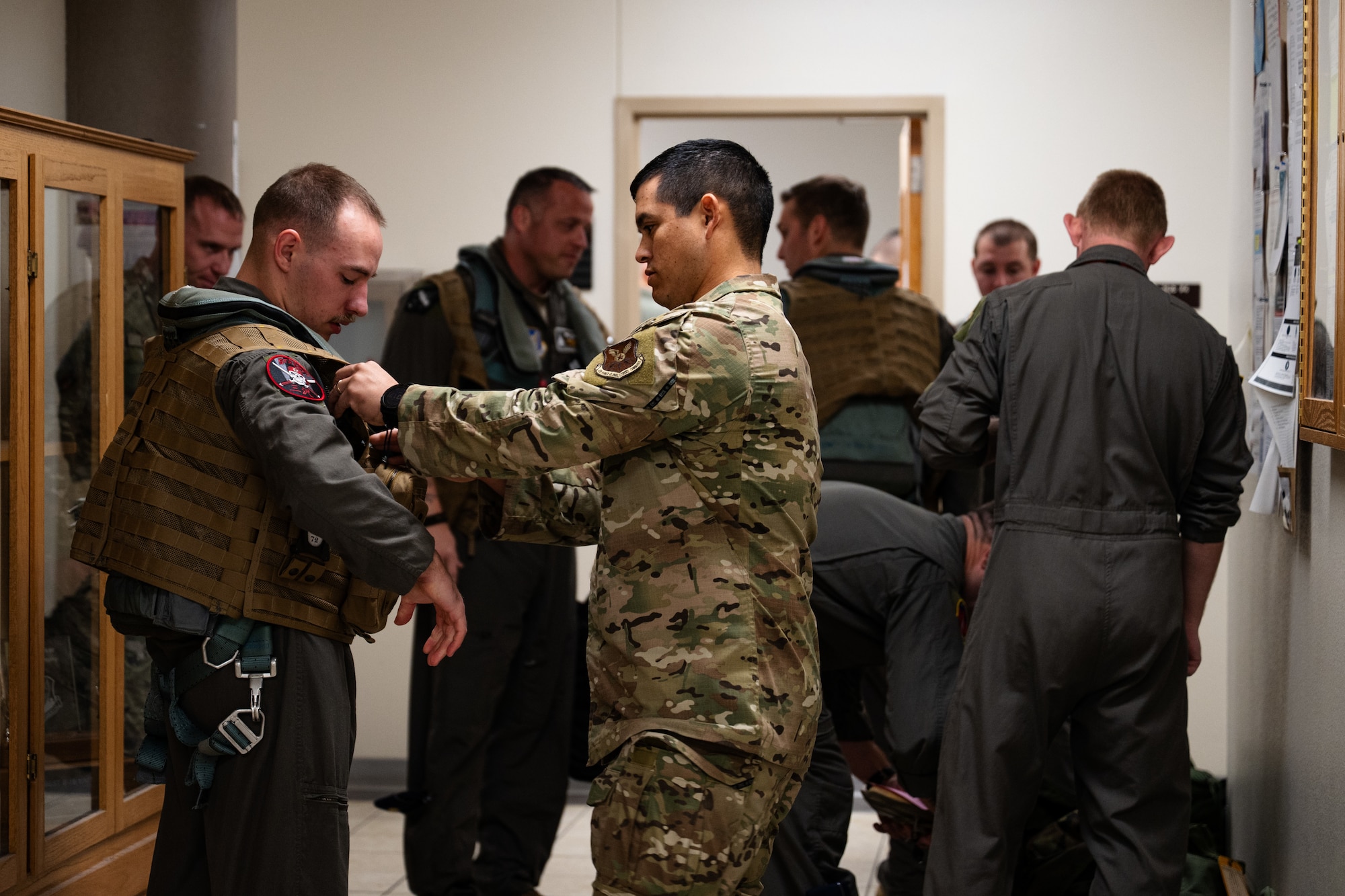 U.S. Airmen assigned to the 9th Bomb Squadron receive aircrew flight equipment in support of a Bomber Task Force deployment at Dyess Air Force Base, Texas, Oct. 16, 2025. Regular bomber missions in the Indo-Pacific ensure 7th Bomb Wing crews are highly trained, fully prepared, and capable of operating anytime, anywhere to defend U.S. interests and support our allies. (U.S. Air Force photo by Senior Airman Jade M. Caldwell)