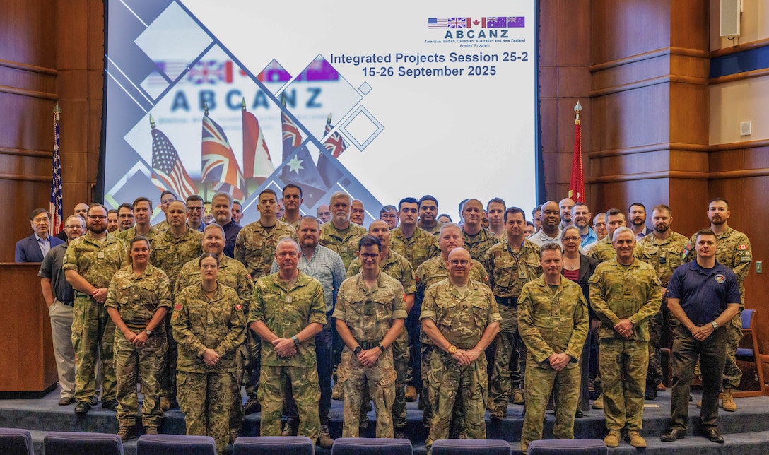 Representatives from the America, Britain, Canada, Australia and New Zealand Armies Program pose for a photo at the Marine Corps University on Marine Corps Base Quantico, Sept. 19, 2025. Military experts who make up the ABCANZ nations, including the U.S. Marine Corps, mustered for the Integrated Project Session held at the MCU, driven by a mission: allies should never have to figure out how to fight together while already engaged with the enemy. IPS unites eight specialized project teams, each addressing a vital element of today’s battlefield. (U.S. Marine Corps photo by Lance Cpl. Donovan Melendez)