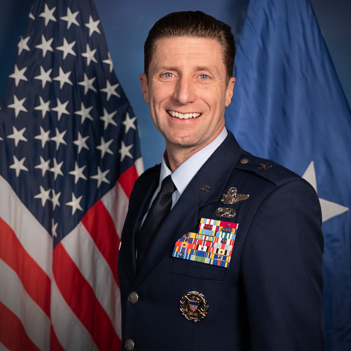 A military member poses for a portrait.
