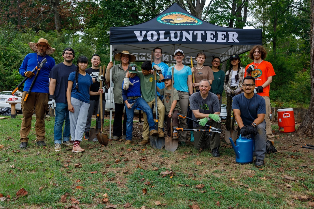 Volunteers working on the pollinator garden pose for a group photo on Marine Corps Base Quantico, Virginia, Sept. 27, 2025. The Quantico Spouses’ Gardening Club and the Conservation Volunteer Program collaborated to bring together volunteers to expand and maintain a pollinator garden on Base to celebrate National Public Lands Day. (U.S. Marine Corps photo by Lance Cpl. Lynsee Avila-Ramirez)