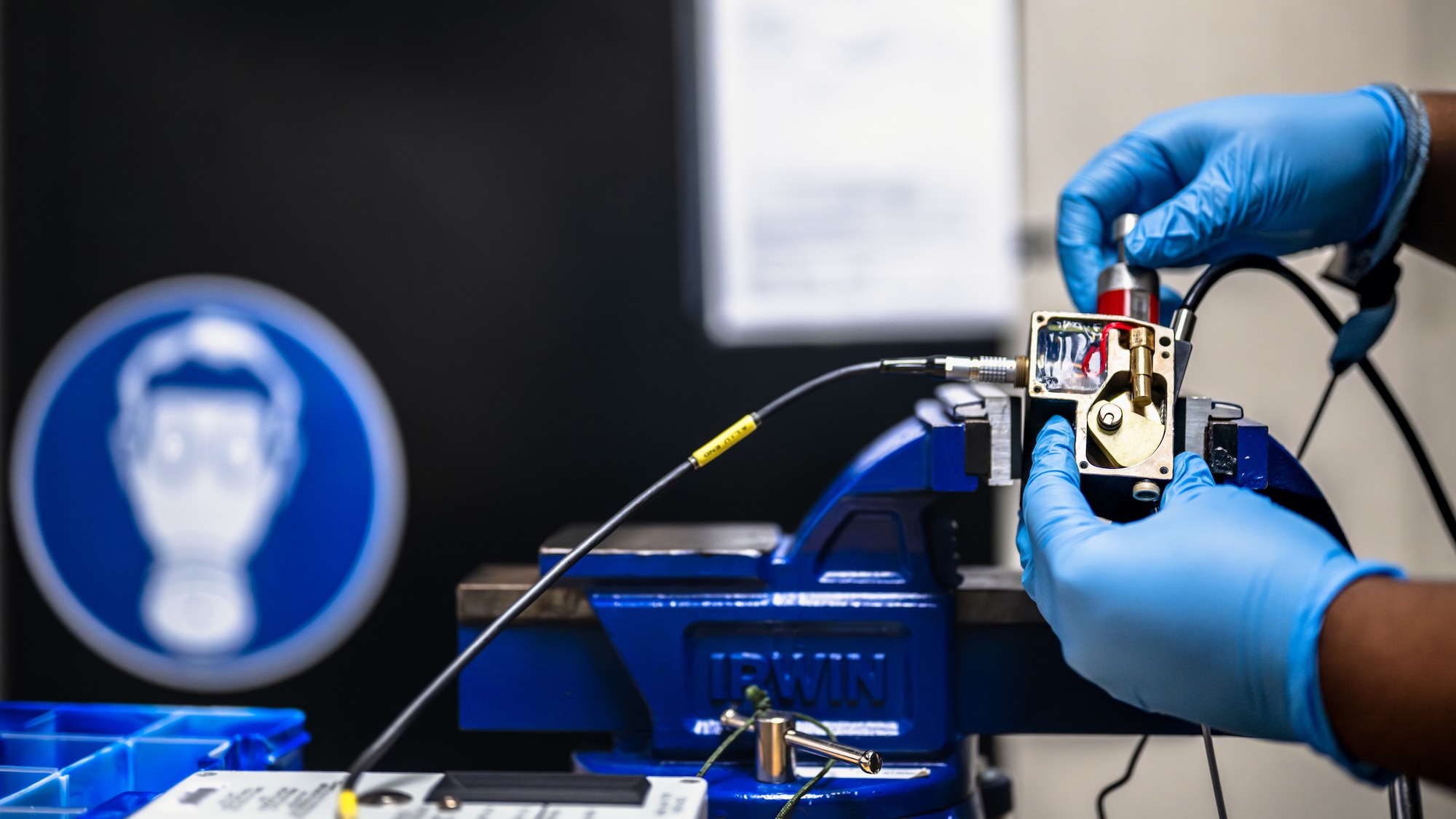 Airman reinstalls a piercer into a CO2 bottle
