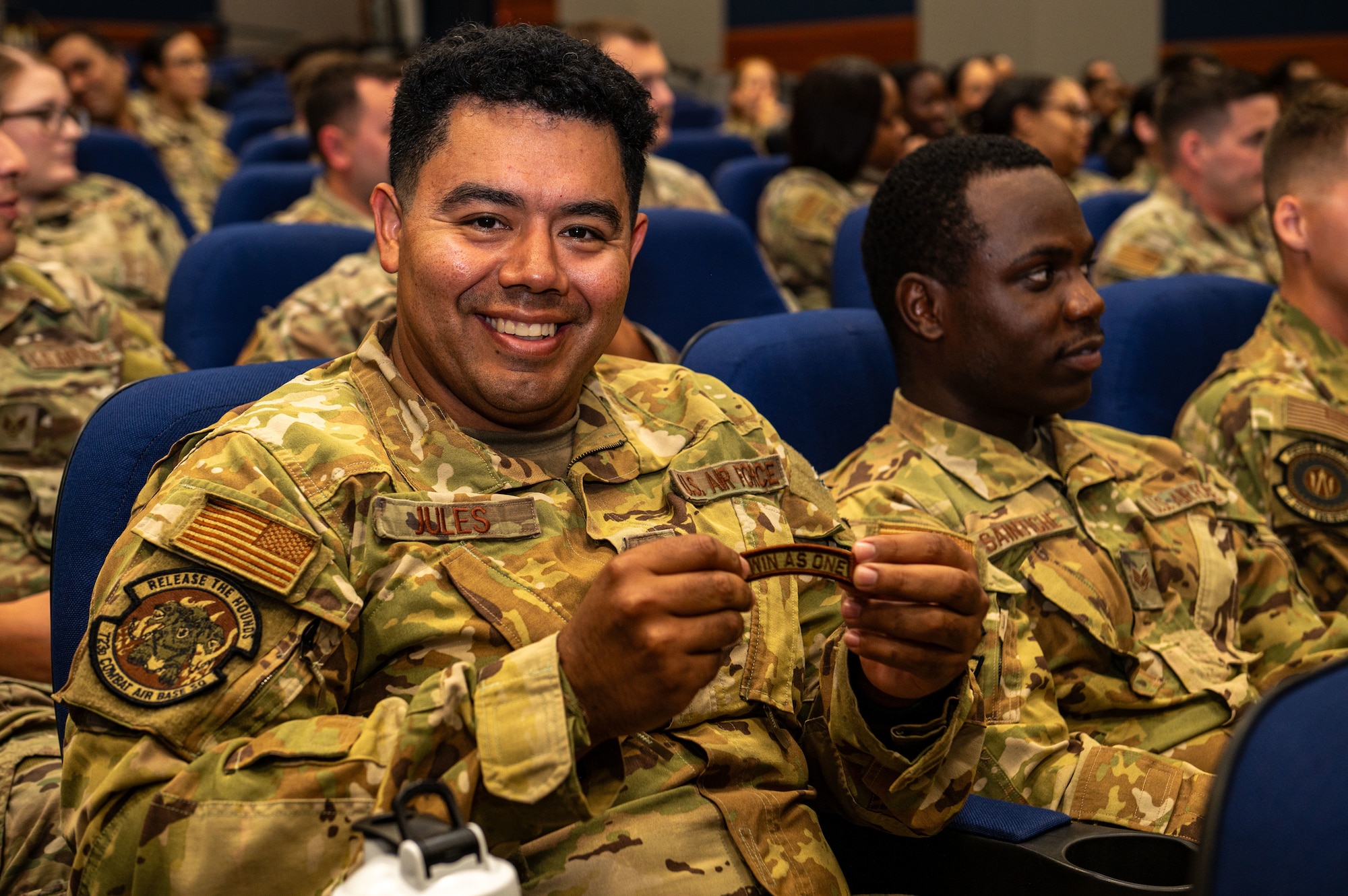 Tech. Sgt. Jonathan Jules, 87th Civil Engineer Squadron firefighter, shows off a "WIN AS ONE" patch awarded to him during the NCO Call at Joint Base McGuire-Dix-Lakehurst, N.J. on September 29, 2025.