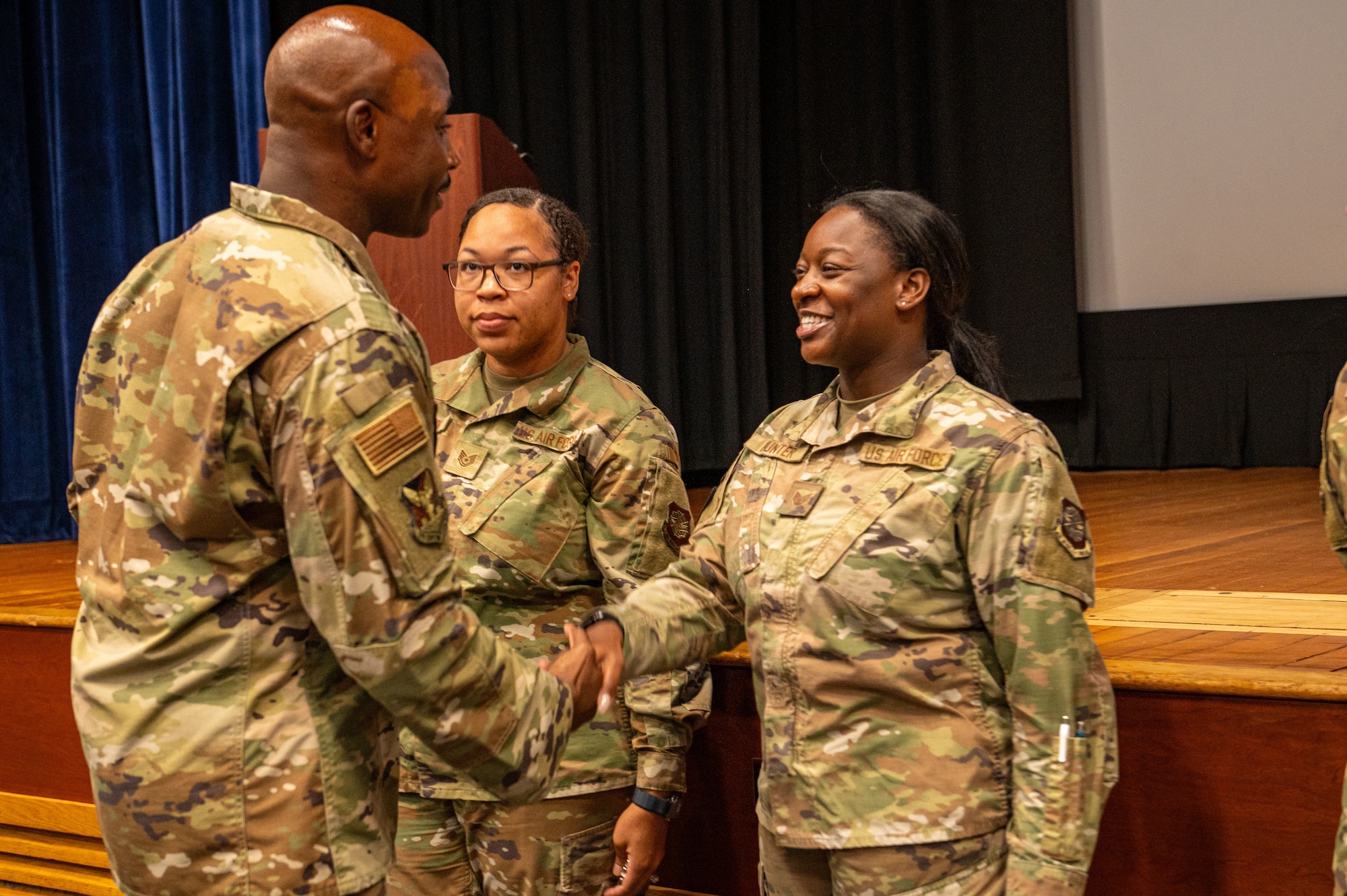 SSgt Anaya Hunter, 787th Civil Engineer Squadron airman dorm leader, is coined by Chief Master Sgt. Nicholas Conner, 87th Air Base Wing command chief during an NCO Call at Joint Base McGuire-Dix-Lakehurst, N.J. on September 29, 2025.