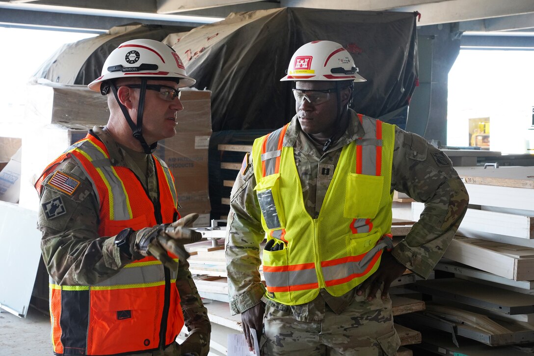 U.S. Army Capt. Idriss Mansaray (right) speaks with Command Sgt. Maj. Douglas Galick, U.S. Army Corps of Engineers Command Sergeant Major, during a recent visit to the Louisville VA Medical Center project.