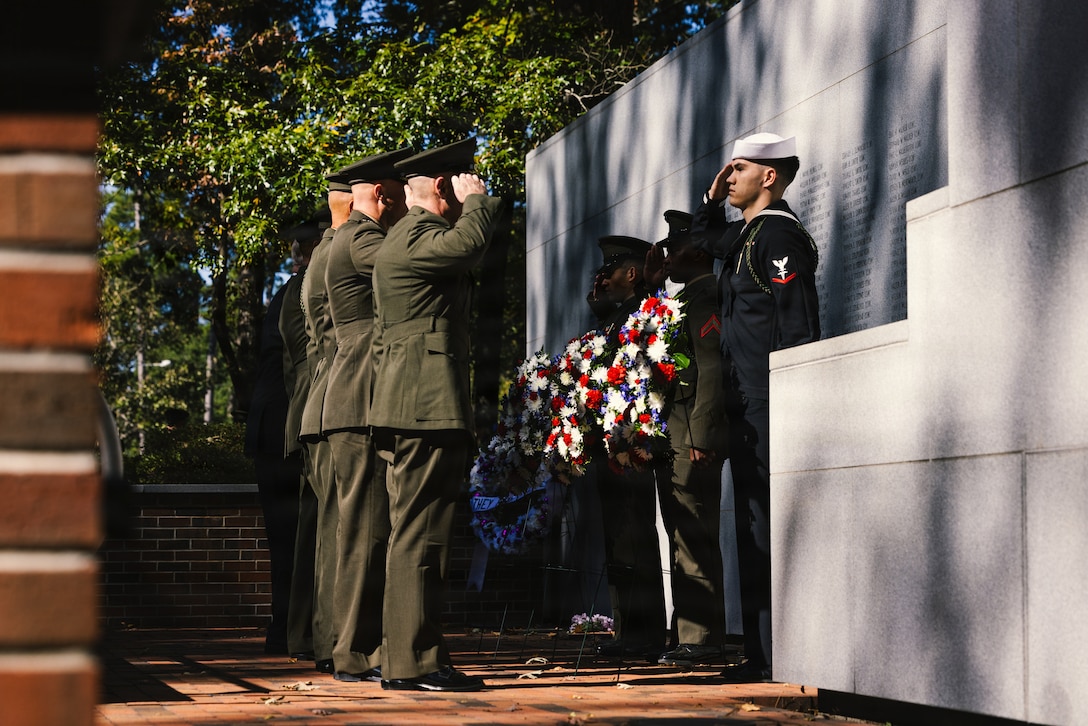 The official party salutes three wreaths honoring the connection of the military and civilian community, those who lost their lives in Beirut and Grenada and the memory of local Marines and Sailors killed in training, during the 42nd anniversary Beirut Memorial Observance Ceremony at the Lejeune Memorial Gardens in Jacksonville, North Carolina, Oct. 23, 2025. U.S. veterans, service members and families gather alongside the community each year on October 23, to remember the lives lost in the terrorist attacks at the U.S. Marine Barracks in Beirut, Lebanon, and Grenada. (U.S. Marine Corps photo by Cpl. Loriann Dauscher)
