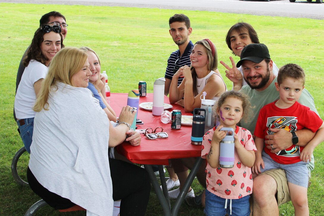 U.S. Army Corps of Engineers Buffalo District Resident Engineer of the Guterl Resident Office Chris Ignatowski and his family gather with other teammates during the district’s annual summer picnic in Niagara Falls, N.Y.