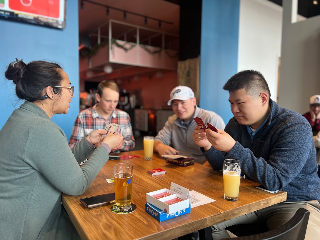 U.S. Army Corps of Engineers, Buffalo District team members socialize during an after-work board game night hosted by the district's Employee Recreation Association.