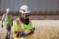 U.S. Army Corps of Engineers’ Kate Conners, right, the lead environmentalist with the South Pacific Border Task Force, requird safety fencing around protected plant species in the state of Arizona during the BMGR-1 project’s environmental survey near Yuma, Arizona, Aug. 26. USACE is replacing permanent border barriers along the southern border of the U.S. at the direction of the U.S. Army by the Secretary of War, in response to the presidential national emergency declaration dated Jan. 20, 2025, authorizing the use of Section 2803 of Title 10, U.S. Code. (Photo by Robert DeDeaux USACE PAO)