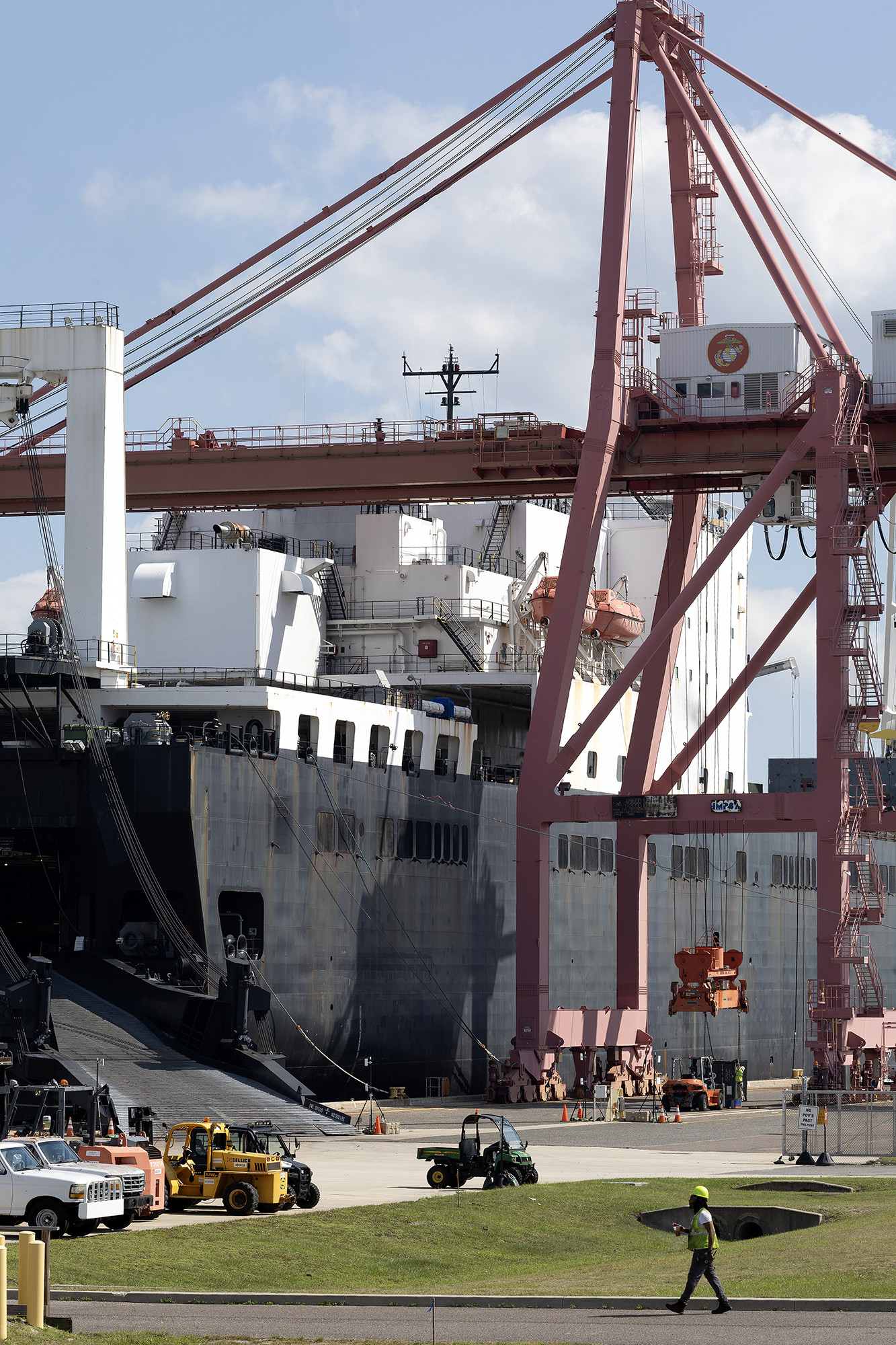 Blount Island Command contractors load equipment aboard the USNS Sgt. William W. Seay on Oct. 21 at Marine Corps Support Facility Blount Island, continuing the deployment of M777 howitzers and critical logistics assets in support of the Marine Corps' readiness across the Indo-Pacific. Marines, Sailors, government civilians and defense contractors collaborate during maritime prepositioning ship backloads to ensure accurate tracking and management of critical assets. (Official Marine Corps Photo by Dustin Senger)