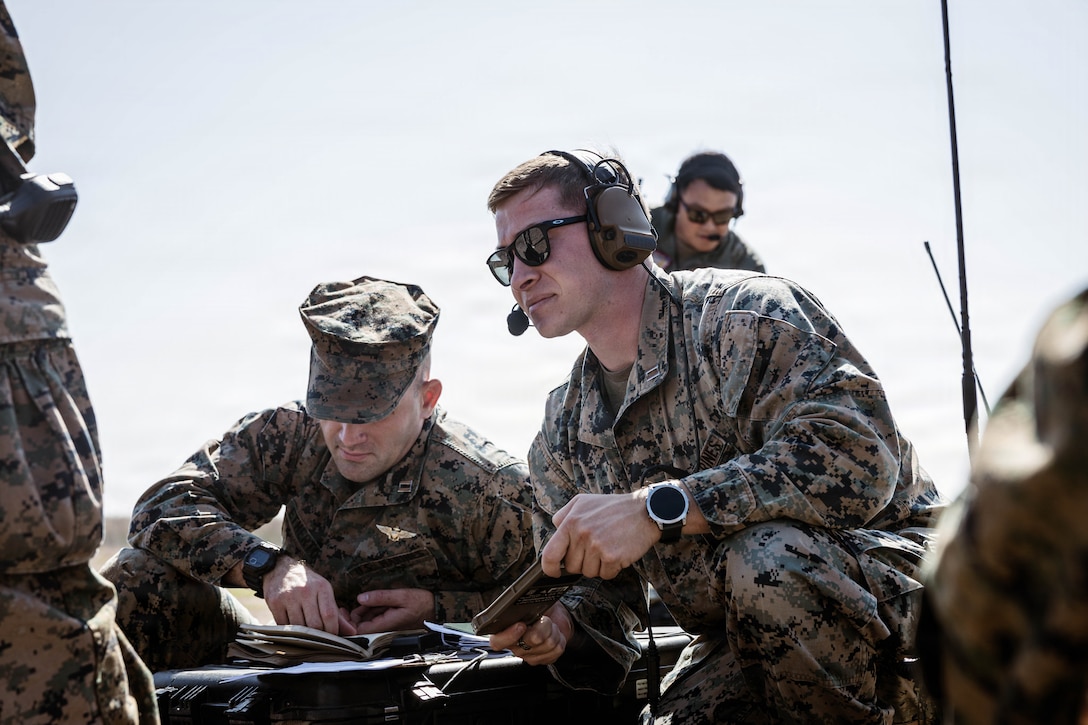 U.S. Marine Corps Capt. Remington Mederos, a team lead with 1st Air Naval Gunfire Liaison Company, I Marine Expeditionary Force Information Group, provides ground support to Marine Light Attack Helicopter Squadron 267, Marine Aircraft Group 39, 3rd Marine Air Wing while they conduct familiarization training with the newly integrated Link 16 Targeting Deconfliction System at Marine Corps Base Camp Pendleton, California, Oct. 28, 2025. The Link 16 system, a secure digital communication network that enhances real-time data exchange and improves command and control. (U.S. Marine Corps Photo by Cpl. Peyton Kahle)