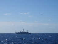 A Coast Guard HC-130 Hercules airplane crew from Air Station Barbers Point monitors a Russian military vessel approximately 15 nautical miles south of Oahu Oct. 29, 2025.