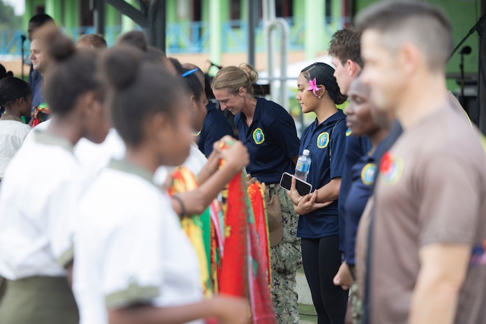 LUGANVILLE, Vanuatu (Nov. 10, 2025) – Pacific Partnership 2025 multinational service members are presented with lavalavas by the students of Santo East School in Luganville, Vanuatu, Nov. 10.