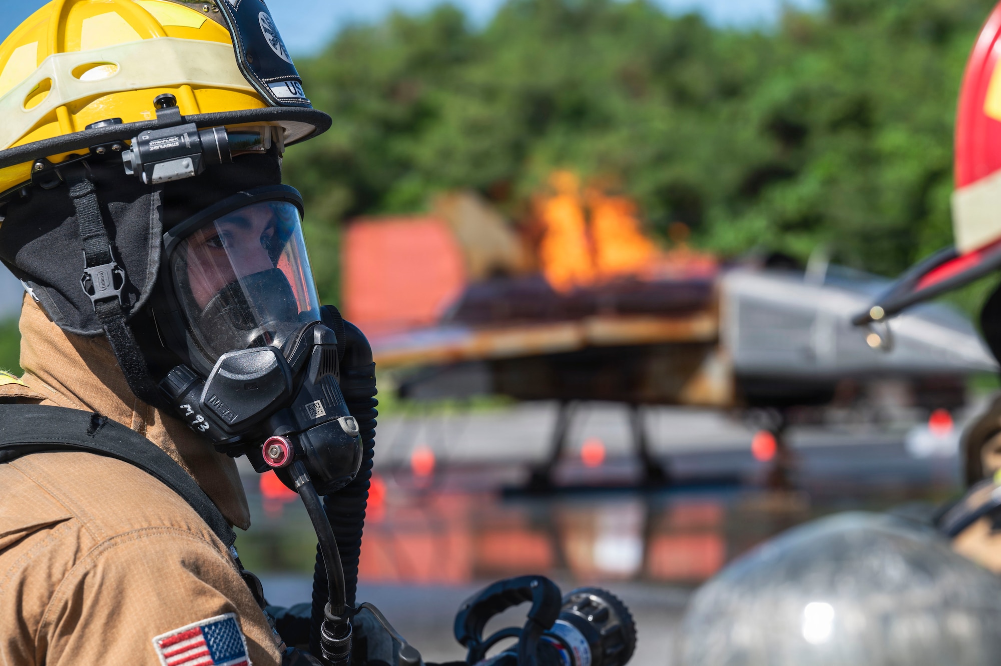 U.S. Air Force Airman 1st Class Luke Hershberger,18th Civil Engineer Squadron Fire and Emergency Services firefighter, operates fire truck controls during base-wide operational readiness exercise BH 26-1 at Kadena Air Base, Japan, Nov. 6, 2025.