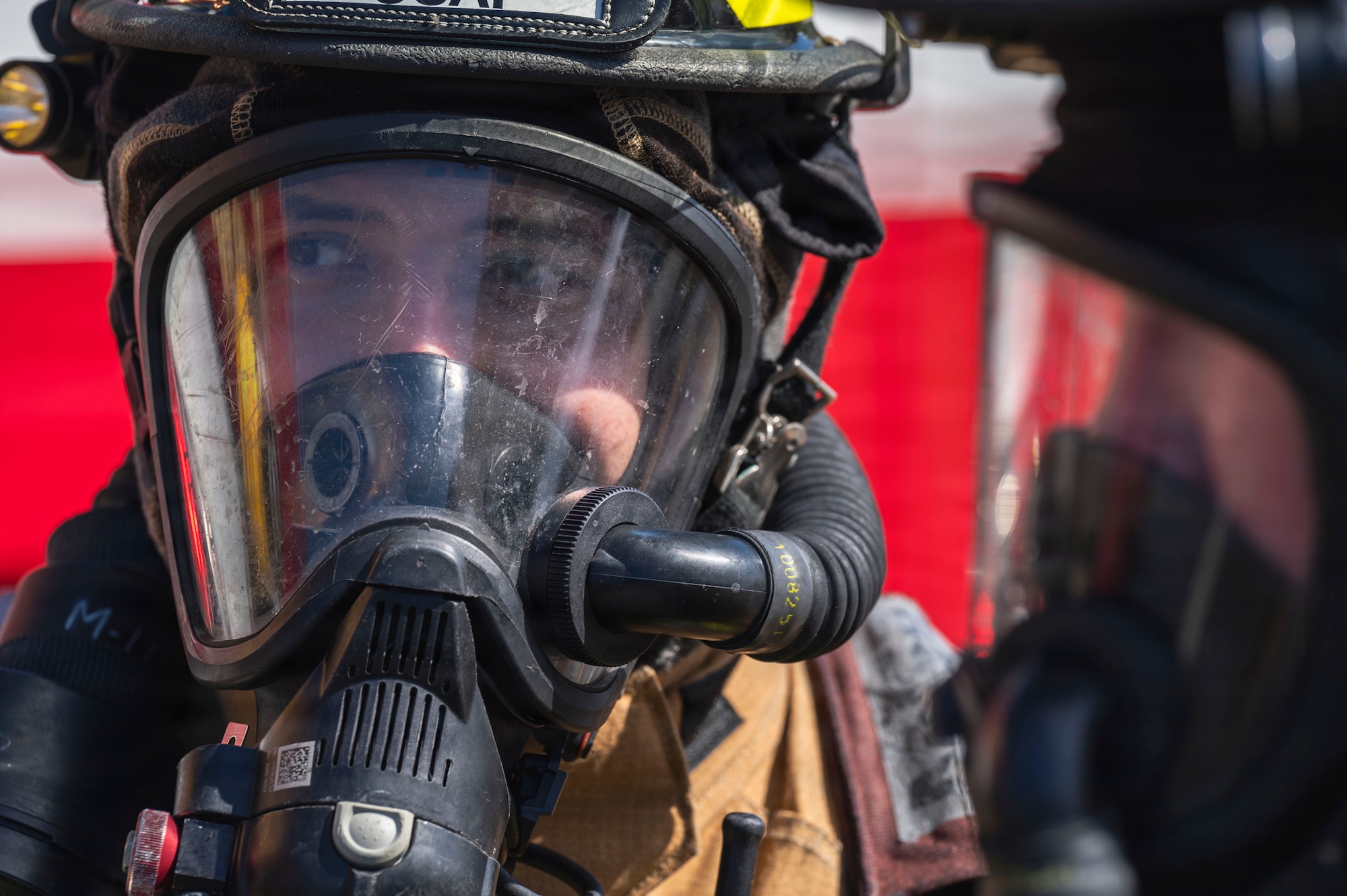 U.S. Air Force Senior Airman Jonathan Rondon-Cruz, 18th Civil Engineer Squadron Fire and Emergency Services driver operator, participates in a simulated aircraft fire response during base-wide operational readiness exercise BH 26-1 at Kadena Air Base, Japan, Nov. 6, 2025.