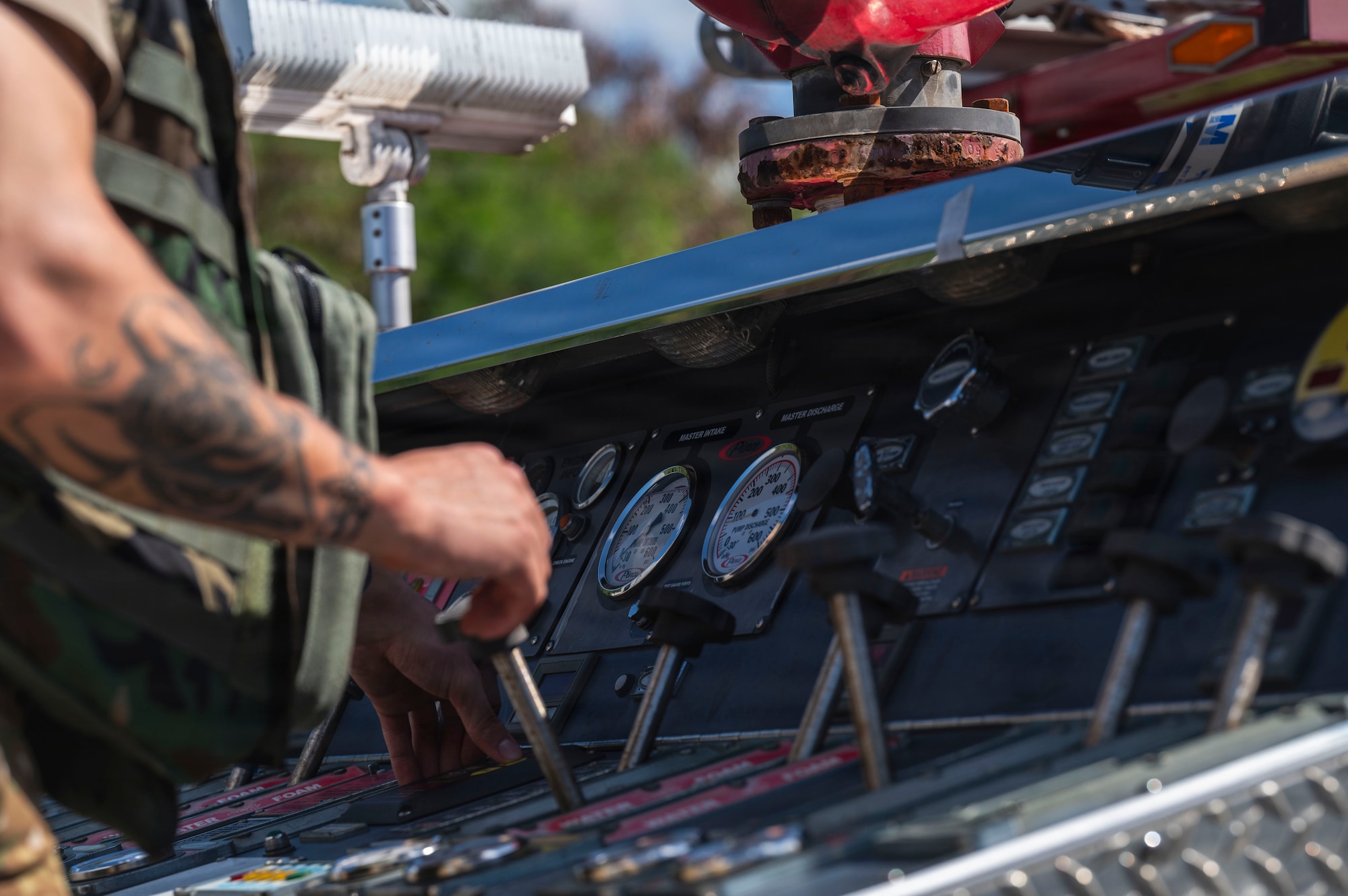 U.S. Air Force Senior Airman Nico Garcia, 18 Civil Engineer Squadron vehicle operator operates fire truck controls during base-wide operational readiness exercise BH 26-1 at Kadena Air Base, Japan, Nov. 6, 2025.