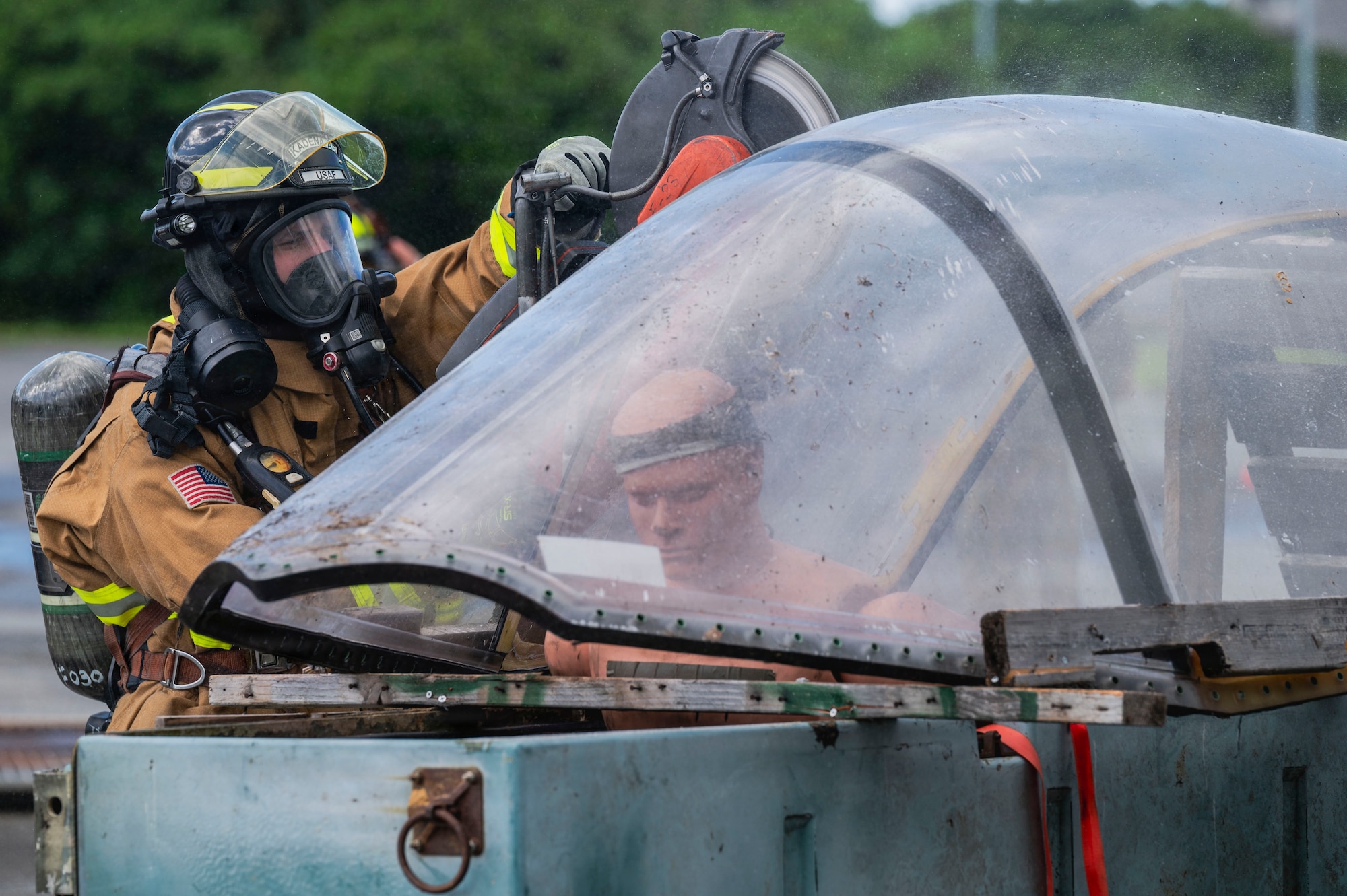 U.S. Air Force Senior Airman Jonathan Rondon-Cruz, 18th Civil Engineer Squadron Fire and Emergency Services driver operator, rescues a patient in a simulated emergency during a base-wide operational readiness exercise BH 26-1 at Kadena Air Base, Japan, Nov. 6, 2025.