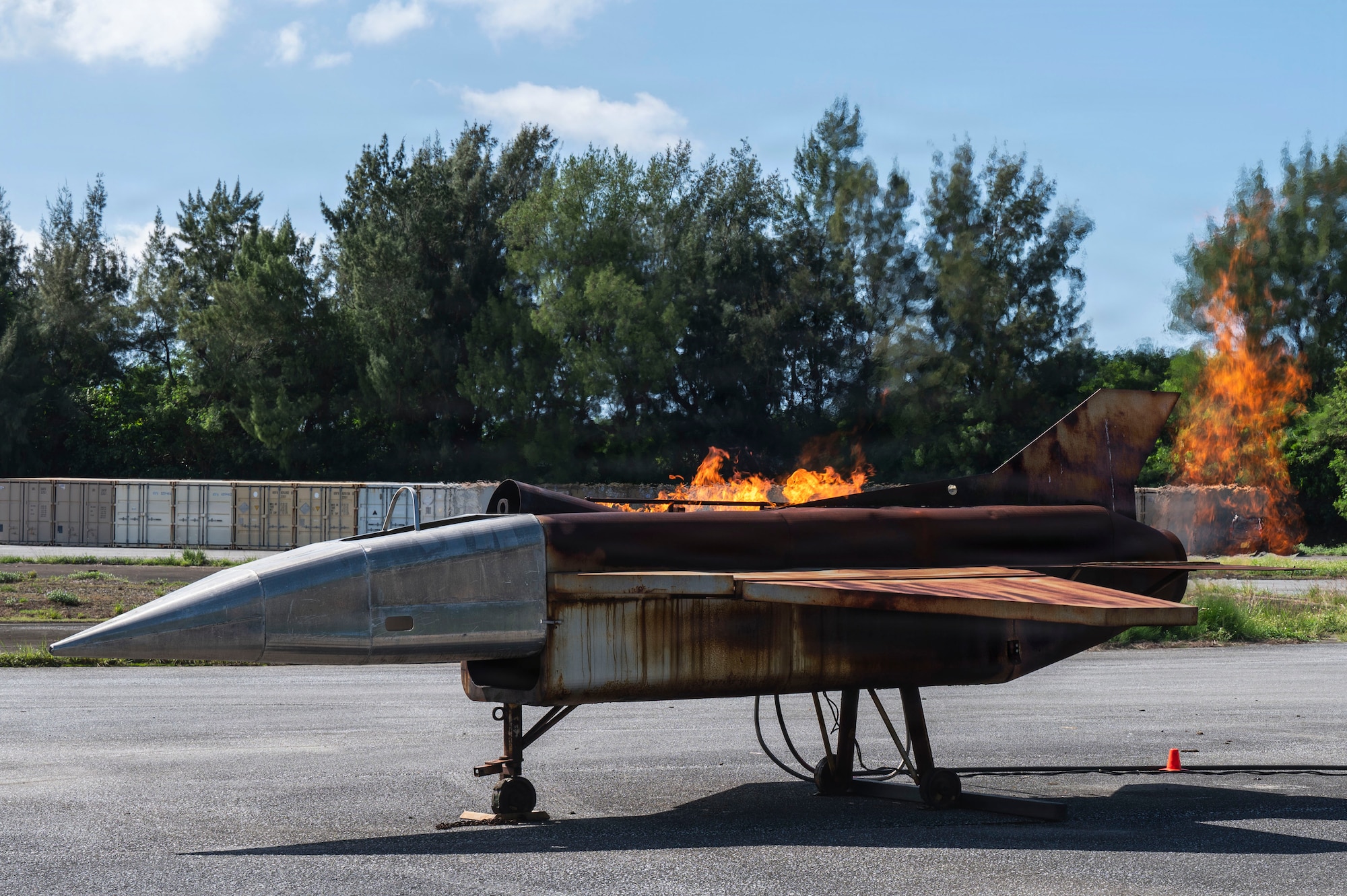 A simulated aircraft burns during an emergency response simulation conducted by the 18th Civil Engineer Squadron during base-wide operational readiness exercise BH 26-1 at Kadena Air Base.