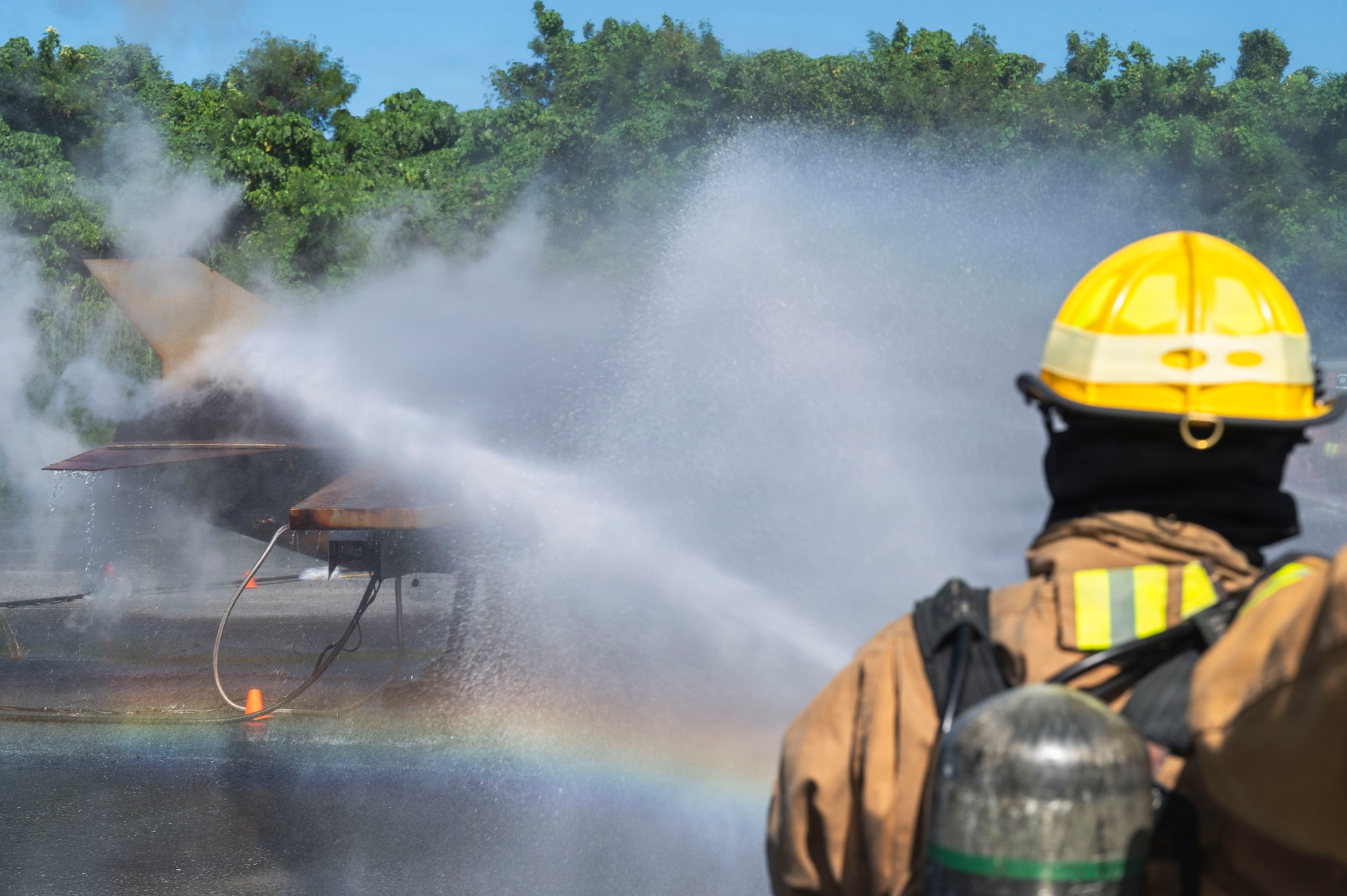 U.S. Air Force Airman 1st Class Luke Hershberger, 18th Civil Engineer Squadron Fire and Emergency Services firefighter, respond to a simulated aircraft fire during base-wide operational readiness exercise BH 26-1 at Kadena Air Base, Japan, Nov. 6, 2025.