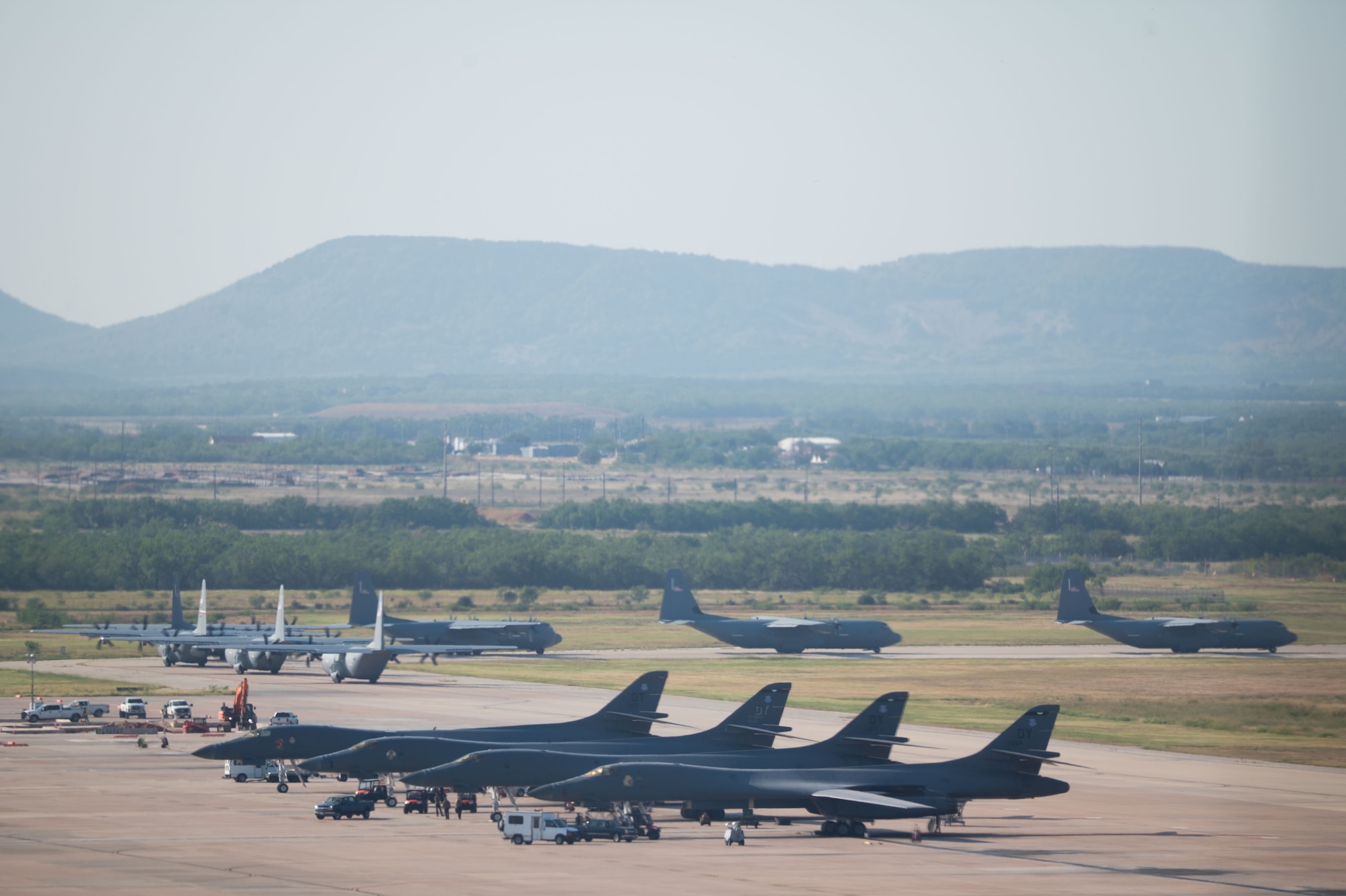 Airmen sit around a conference table