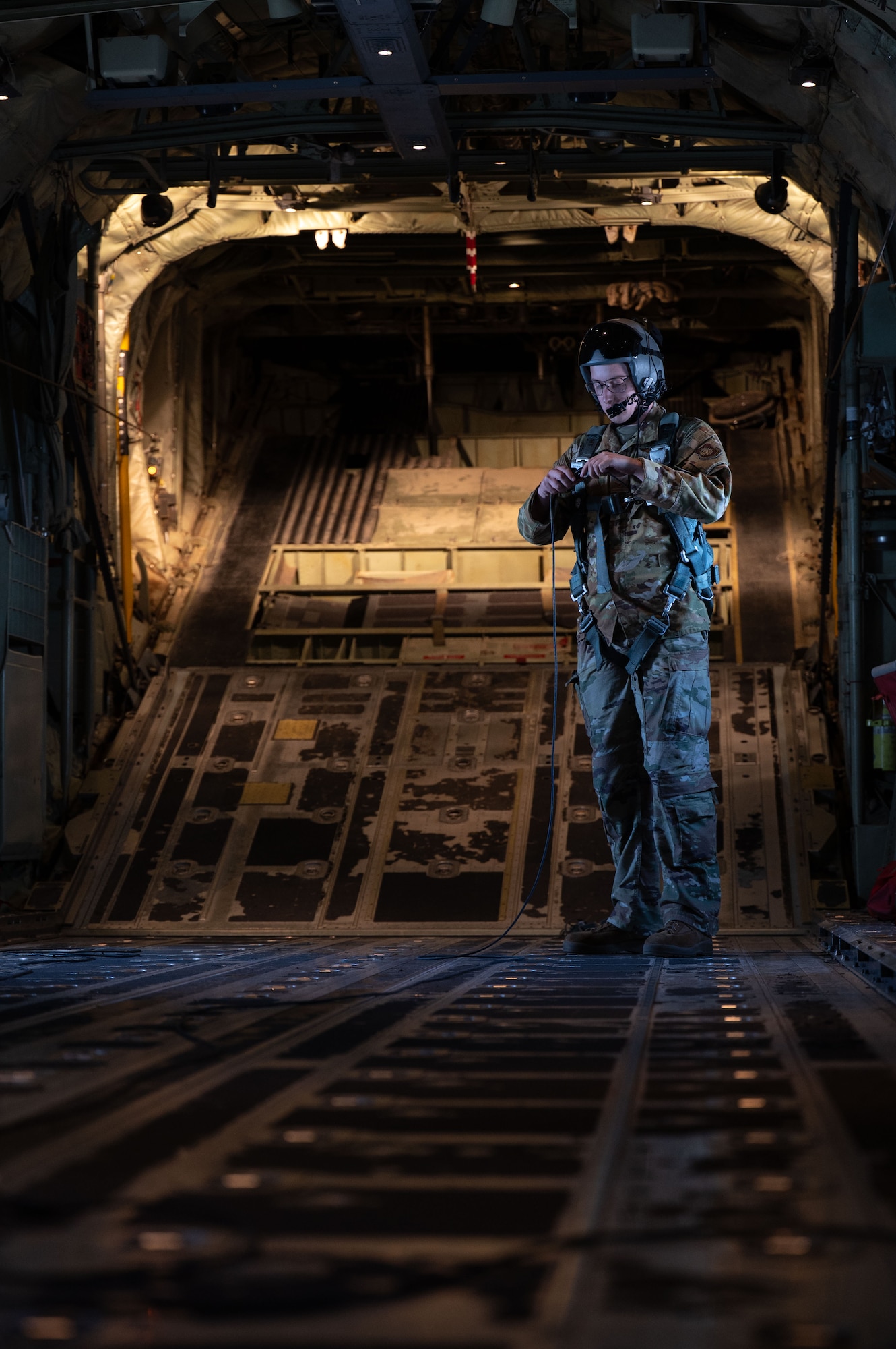 Airmen sit around a conference table