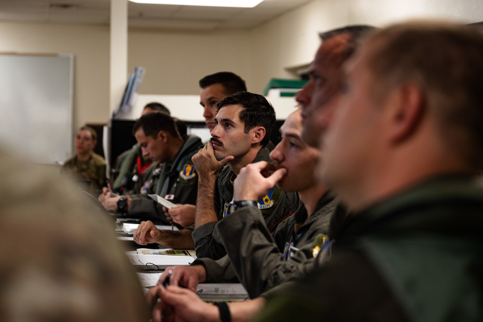 U.S. Airmen assigned to the 9th Bomb Squadron receive a preflight mission brief in support of a Bomber Task Force deployment at Dyess Air Force Base, Texas, Oct. 16, 2025. Regular bomber missions in the Indo-Pacific ensure 7th Bomb Wing crews are highly trained, fully prepared, and capable of operating anytime, anywhere to defend U.S. interests and support our allies. (U.S. Air Force photo by Senior Airman Jade M. Caldwell)