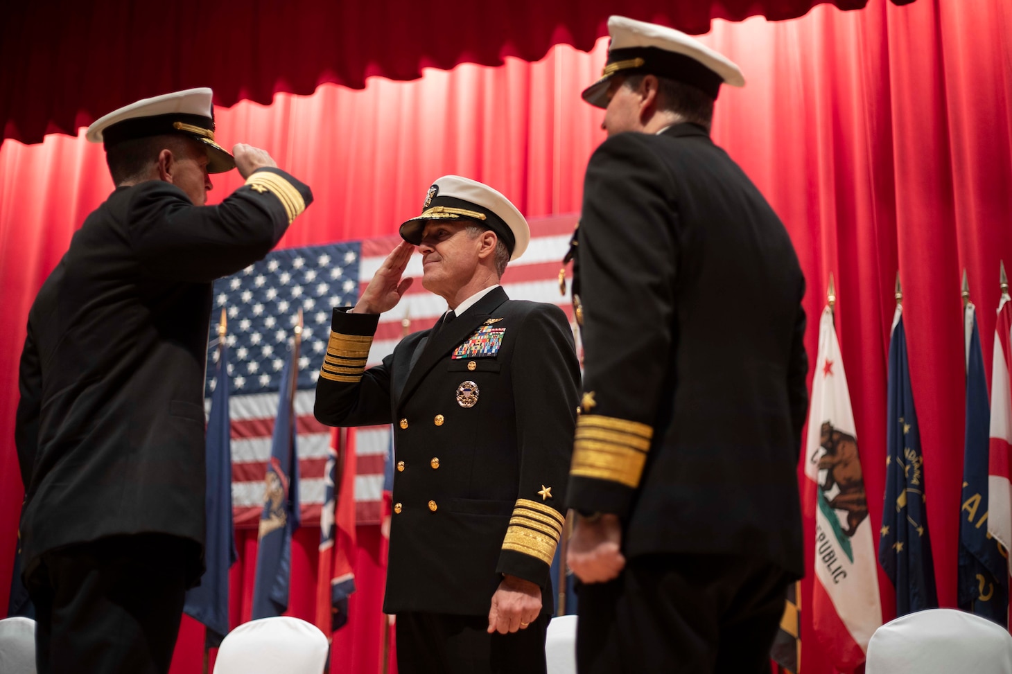 Vice Adm. Patrick Hannifin, left, salutes  Adm. Steve Koehler, commander, U.S. Pacific Fleet, as he assumes command of Commander, U.S. 7th Fleet from Vice Adm. Fred Kacher, right, during the U.S. 7th Fleet Change of Command ceremony on board Commander, Fleet Activities Yokosuka, Nov. 13.