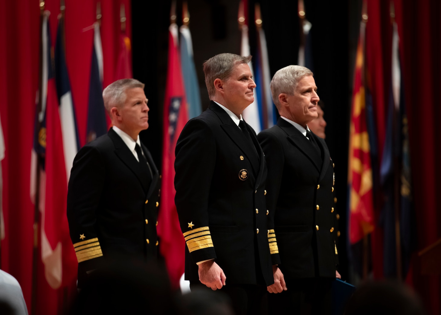 From left to right, Oncoming Commander, U.S. 7th Fleet Vice Adm. Patrick Hannifin, Off-going Commander, U.S. 7th Fleet Vice Adm. Fred Kacher, and Adm. Steve Koehler, commander, U.S. Pacific Fleet, stand at attention during the U.S. 7th Fleet Change of Command ceremony onboard Commander, Fleet Activities Yokosuka, Nov. 13.