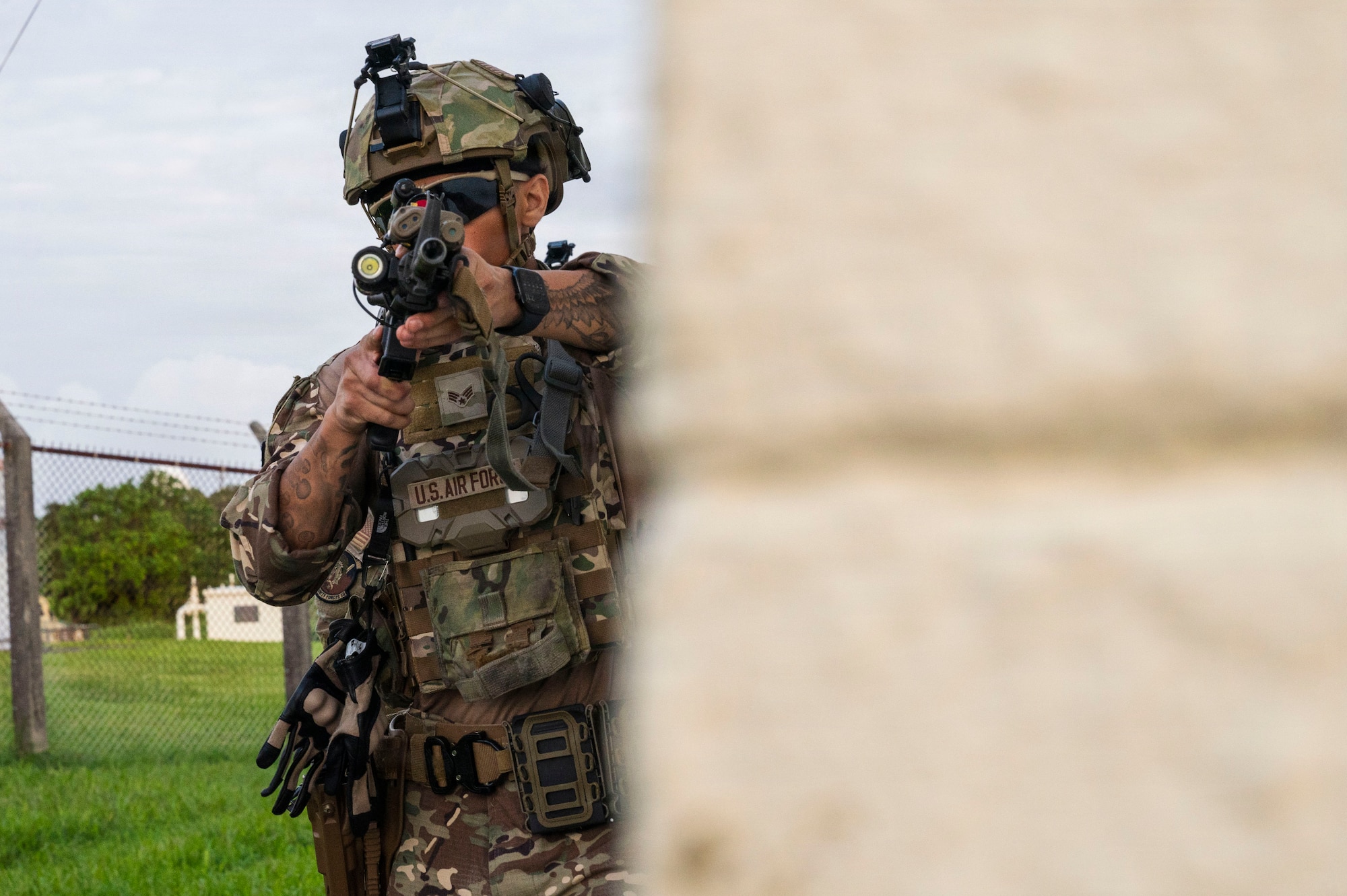 U.S. Air Force Senior Airman Nathan Herrera, 18th Security Forces Squadron special reaction team member, prepares to clear the corner of the 18th Communications Squadron building during a simulated active shooter exercise at Kadena Air Base, Japan, Nov. 4, 2025.