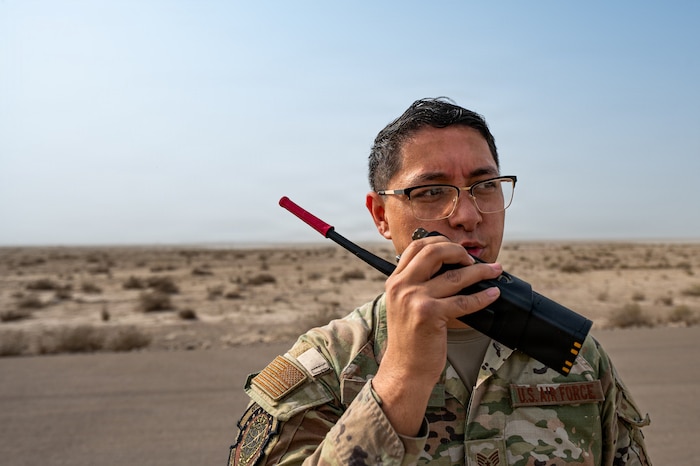 uniformed man speaks on radio