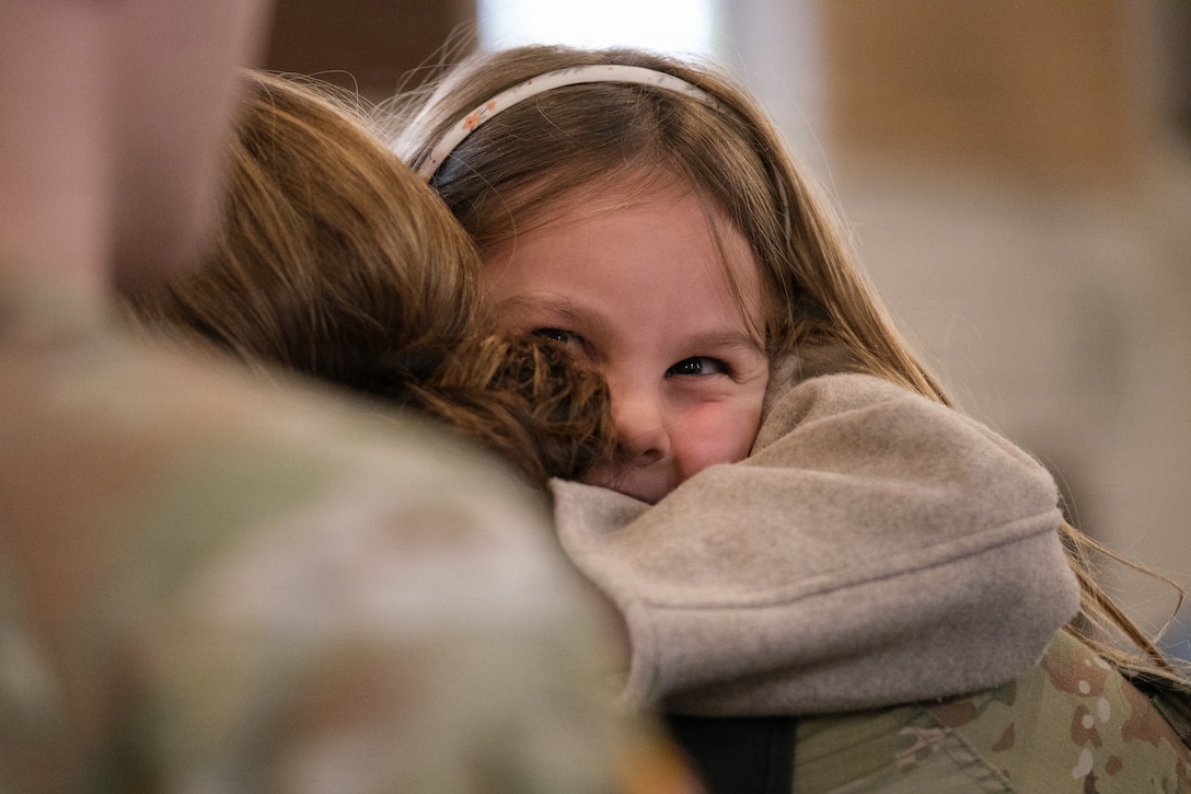 U.S. Army Reserve 1st Lt. Vanessa Medina, the 510th Regional Support Group’s Headquarters and Headquarters Company executive officer, poses for a photo besides her spouse after the conclusion of her unit’s farewell ceremony Oct. 24, 2025, at Daenner Chapel on Daenner Kaserne. The 510th RSG, 7th Mission Support Command, is scheduled to mobilize across the European theater, assuming base support and life-sustainment operation responsibilities from the 297th RSG of the Alaska National Guard, reinforcing the Army’s deterrence posture along the eastern flank. (U.S. Army Reserve photo by Lt. Col. William Wratee).