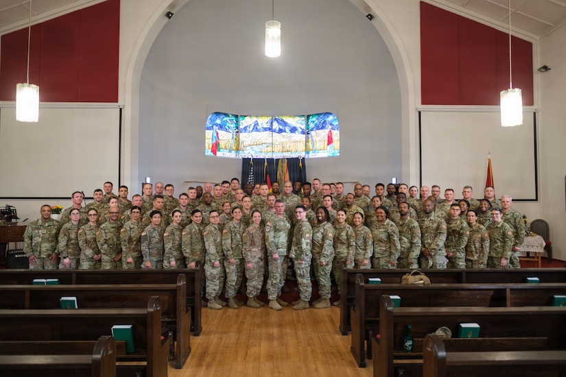 U.S. Army Reserve 1st Lt. Vanessa Medina, the 510th Regional Support Group’s Headquarters and Headquarters Company executive officer, poses for a photo besides her spouse after the conclusion of her unit’s farewell ceremony Oct. 24, 2025, at Daenner Chapel on Daenner Kaserne. The 510th RSG, 7th Mission Support Command, is scheduled to mobilize across the European theater, assuming base support and life-sustainment operation responsibilities from the 297th RSG of the Alaska National Guard, reinforcing the Army’s deterrence posture along the eastern flank. (U.S. Army Reserve photo by Lt. Col. William Wratee).
