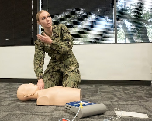HOUSTON, Texas (Nov. 13, 2025) — Hospital Corpsman 2nd Class Kayla Pahl instructs Sailors on proper cardiopulmonary resuscitation (CPR) techniques during a Basic Life Support (BLS) training session at Navy Talent Acquisition Group Houston. Pahl, a BLS Instructor, uses her fleet and instructional experience to help prepare Sailors with essential life-saving skills. (U.S. Navy photo by Mass Communication Specialist 1st Class Louis Rojas)