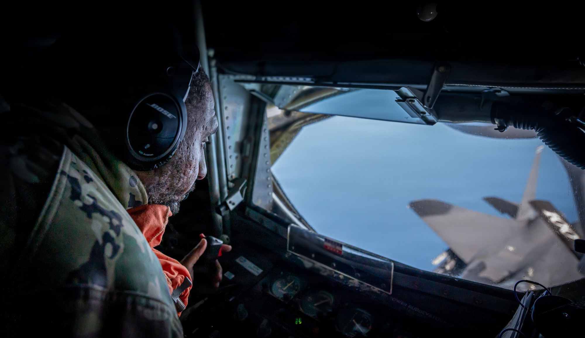 U.S. Air Force Staff Sgt. Jamar Campbell, 351st Air Refueling Squadron boom operator, refuels a U.S. Air Force F-15E Strike Eagle from the 48th Fighter Wing, RAF Lakenheath, during exercise Ocean Sky, over the Atlantic Ocean, Oct. 15, 2025