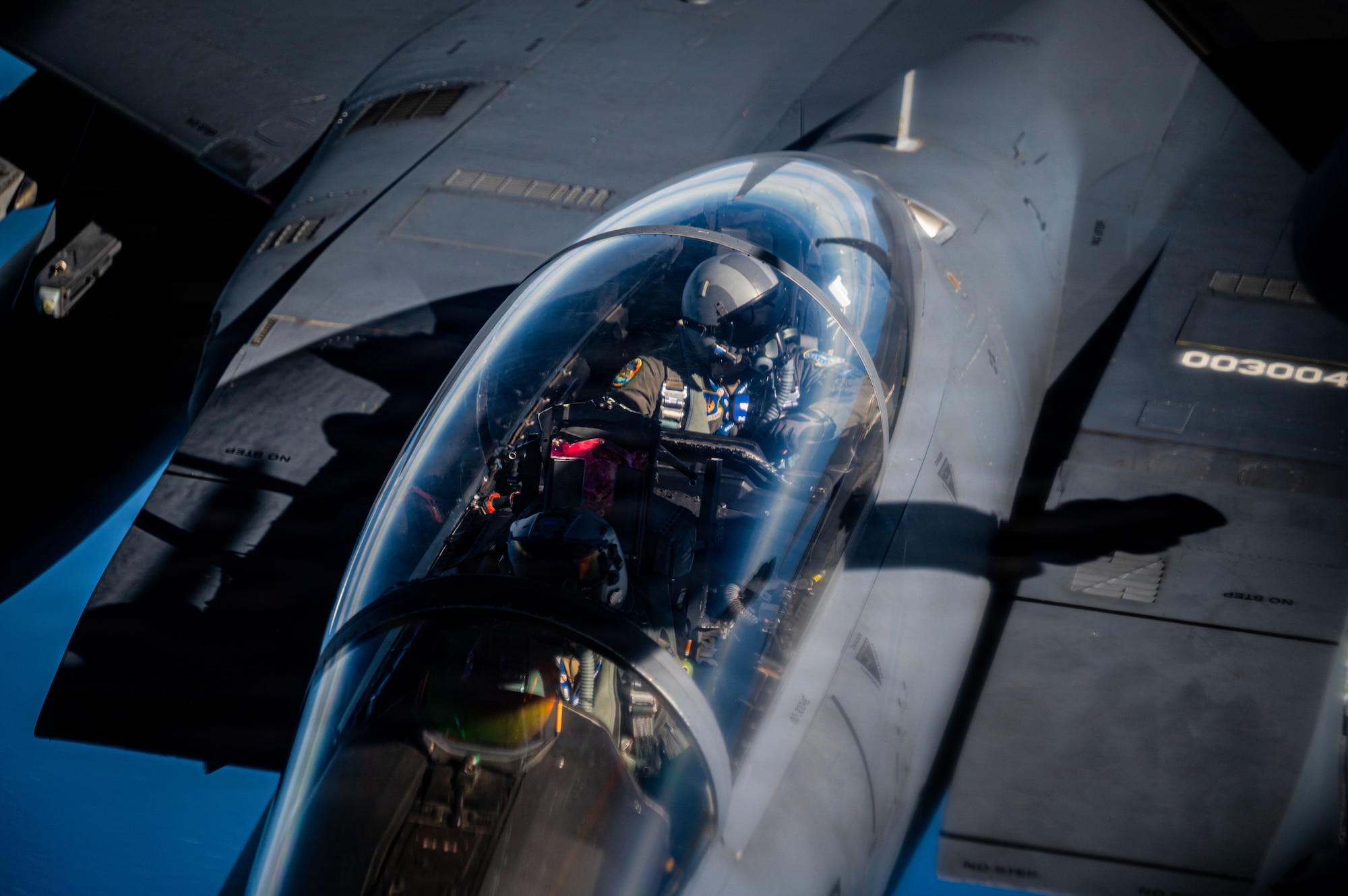 A U.S. Air Force F-15E Strike Eagle from the 48th Fighter Wing approaches a KC-135 Stratotanker aircraft from the 100th Air Refueling Wing at RAF Mildenhall, during exercise Ocean Sky, over the Atlantic Ocean, Oct. 15, 2025.