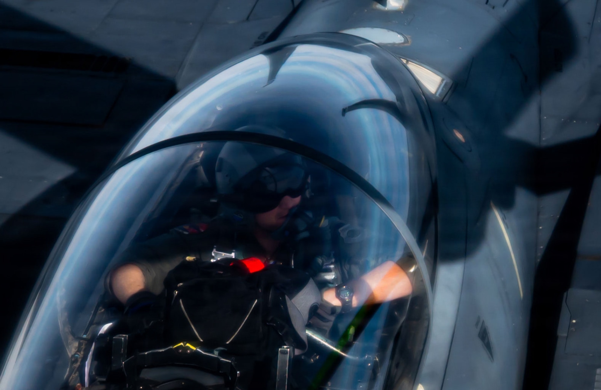 A U.S. Air Force F-15E Strike Eagle pilot from the 48th Fighter Wing approaches a KC-135 Stratotanker from the 100th Air Refueling Wing during exercise Ocean Sky, over the Atlantic Ocean, Oct. 15, 2025.