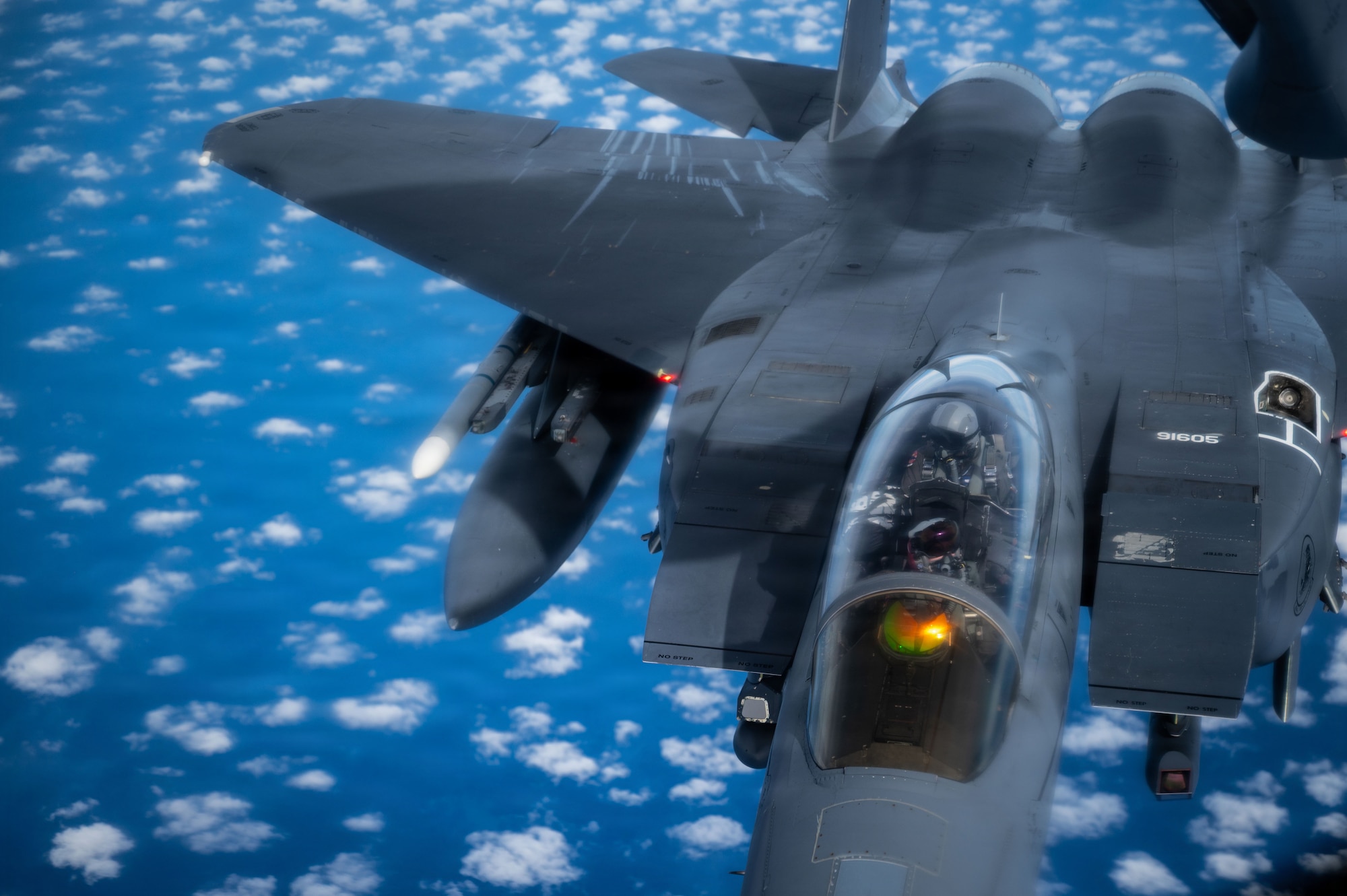 A U.S. Air Force F-15E Strike Eagle from the 48th Fighter Wing approaches a KC-135 Stratotanker from the 100th Air Refueling Wing during exercise Ocean Sky, over the Atlantic Ocean, Oct. 15, 2025.