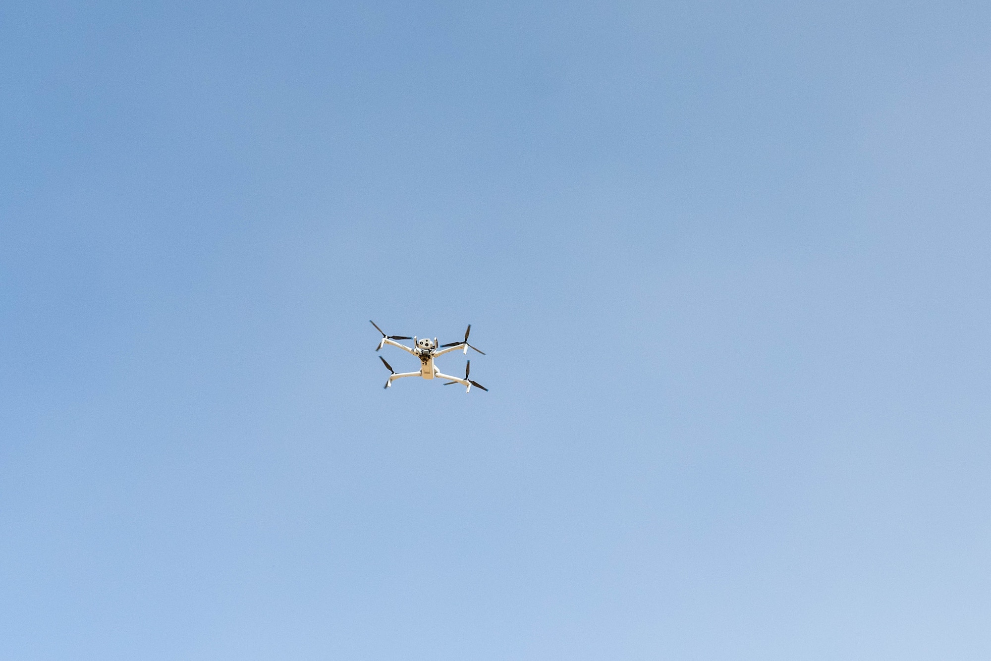 A Skydio quadcopter hovers in the U.S. Central Command area of responsibility Nov. 6, 2025. The quadcopter is equipped with multiple camera capabilities, including a 360-degree field of view, thermal imaging and advanced high-resolution zoom, giving defenders a detailed look at their surroundings. (U.S. Air Force photo by Senior Airman Kari Degraffenreed)