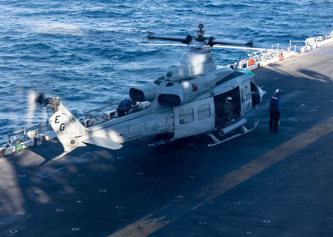 CARIBBEAN SEA – A U.S. Marine Corps UH-1Y Venom helicopter with Marine Medium Tiltrotor Squadron (VMM) 263 (Reinforced), 22nd Marine Expeditionary Unit (Special Operations Capable), prepares to take off during flight operations aboard Wasp-class amphibious assault ship USS Iwo Jima (LHD 7) while underway in the Caribbean Sea, Oct. 30, 2025. U.S. military forces are deployed to the Caribbean in support of the U.S. Southern Command mission, Department of War-directed operations, and the president’s priorities to disrupt illicit drug trafficking and protect the homeland. (U.S. Marine Corps photo)