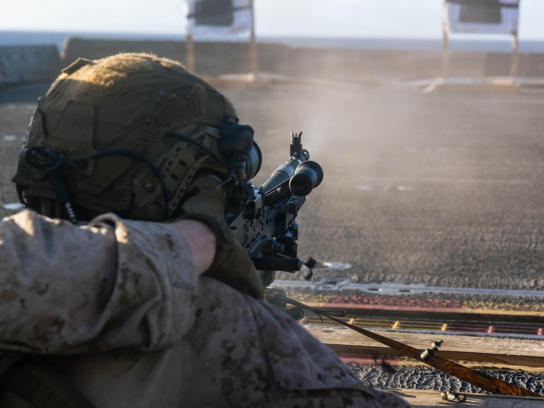 CARIBBEAN SEA – A U.S. Marine with Battalion Landing Team 3/6, 22nd Marine Expeditionary Unit (Special Operations Capable), fires an M240B machine gun during a live-fire deck shoot aboard Wasp-class amphibious assault ship USS Iwo Jima (LHD 7) while underway in the Caribbean Sea, Oct. 24, 2025. U.S. military forces are deployed to the Caribbean in support of the U.S. Southern Command mission, Department of War-directed operations, and the president’s priorities to disrupt illicit drug trafficking and protect the homeland. (U.S. Marine Corps photo by Sgt. Tanner Bernat)