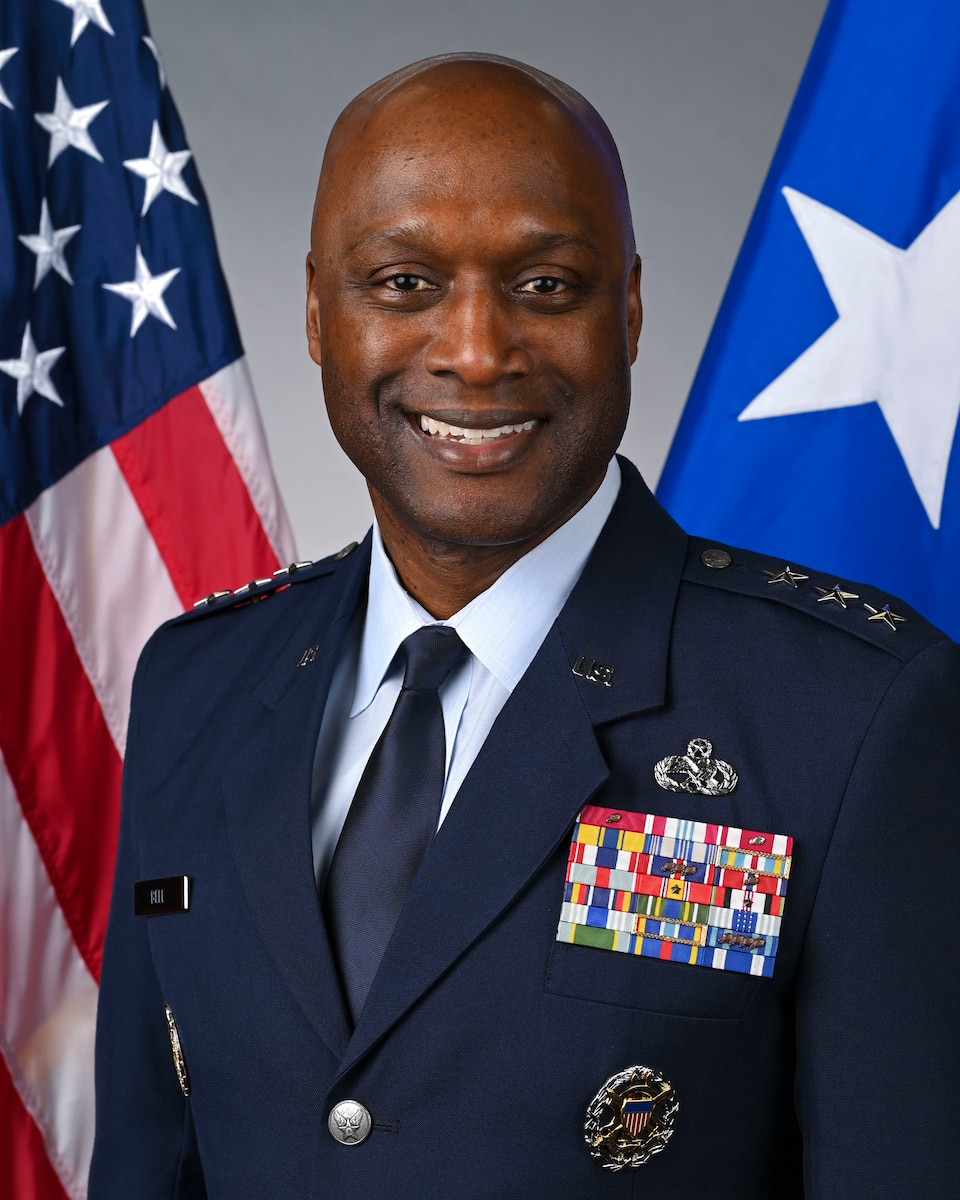 A military member poses for a portrait.