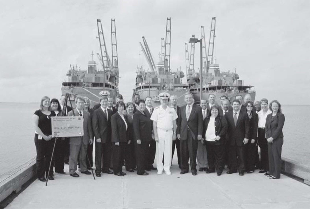Group of people pose on a ship