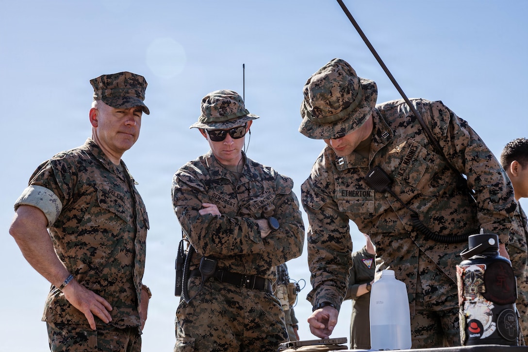 U.S. Marine Corps Col. William DeLeal II, commanding officer of I Marine Expeditionary Force Information Group discusses the Link 16 Targeting Deconfliction System with 1st Air Naval Gunfire Liaison Company, I MIG at Marine Corps Base Camp Pendleton, California, Oct. 30, 2025. The Link 16 Targeting Deconfliction System, a secure digital communication network that enhances real-time data exchange and improves command and control. (U.S. Marine Corps Photo by Cpl. Peyton Kahle)