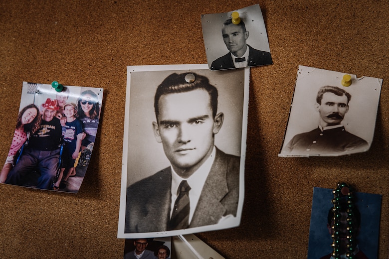 Photos displayed in the residence of U.S. Marine Corps Pfc. John Grimes, a World War II veteran, during a visit from Marines with Marine Corps Base Quantico’s Ceremonial Platoon to celebrate the upcoming 250th birthday of the Marine Corps at The Jefferson, Arlington, Virginia, Oct. 10, 2025. Grimes enlisted in the Marine Corps in 1943 and became a radio operator and fought in WWII during the battle of Tinian in 1944. During the battle he was injured by a mortar blast and later awarded the Purple Heart. (U.S. Marine Corps photo by Lance Cpl. Harleigh Faulk)